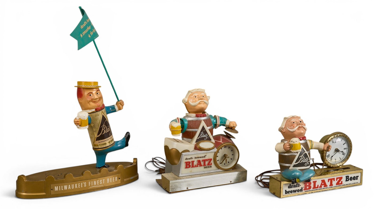 (3) Blatz Beer Advertising Statues: Three Blatz Beer advertising statues, two with clocks height 20 in. x 14.5 in. x 5 in. / largest Provenance: Property from the collection of Linda Muth, from her home in the Hollywood