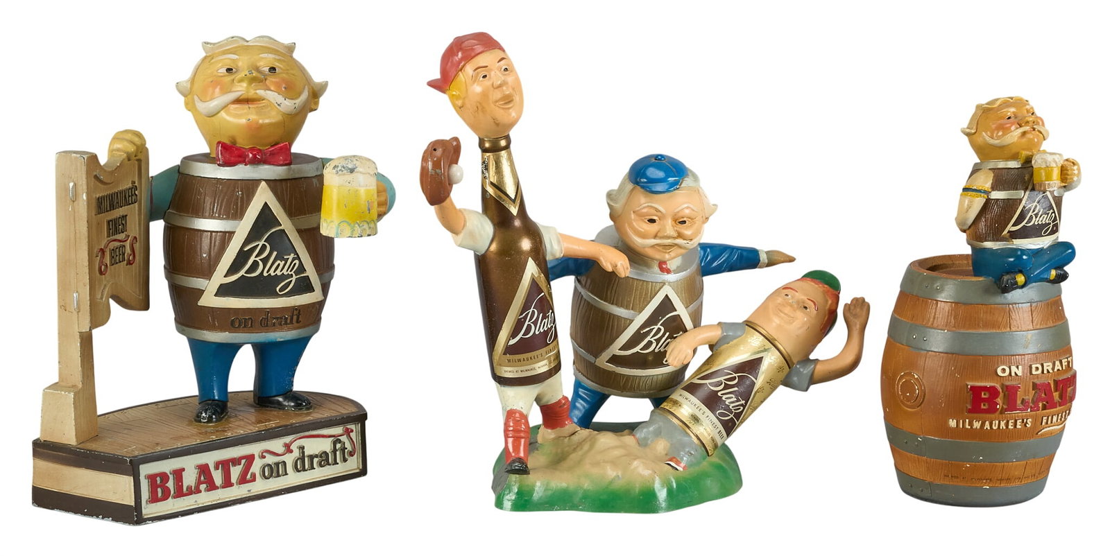 (3) Blatz Beer Barrel Objects: (3) Blatz Beer advertising figures with two barrel figures and one set of three baseball players height 16.5 in. x width 18.5 in. x depth 9.5 in. Provenance: Property from the