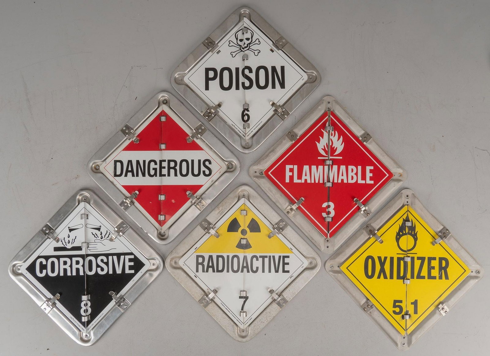 (6) Hazard Warning Signs: Collection of six metal signs with interchangeable faces, offering a variety of warning that include "flammable", "poisonous", "corrosive", and "radioactive"