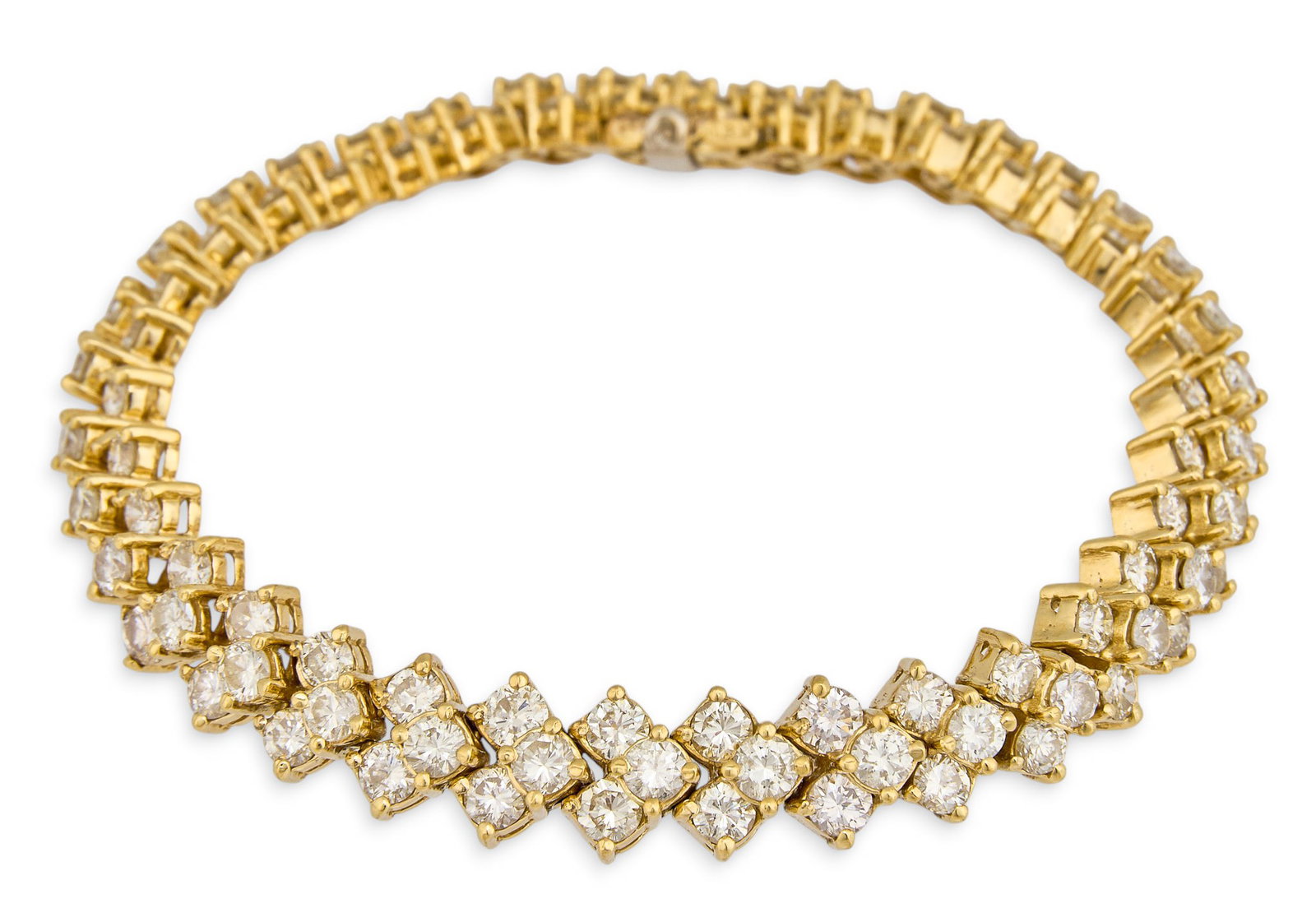 Impressive Diamond Tennis Bracelet: 18K yellow gold reticulated tennis bracelet, set with round brilliant cut graduated diamonds, marked "18K" Length: 7 in. Total weight: 29.3 g Provenance: Property from the