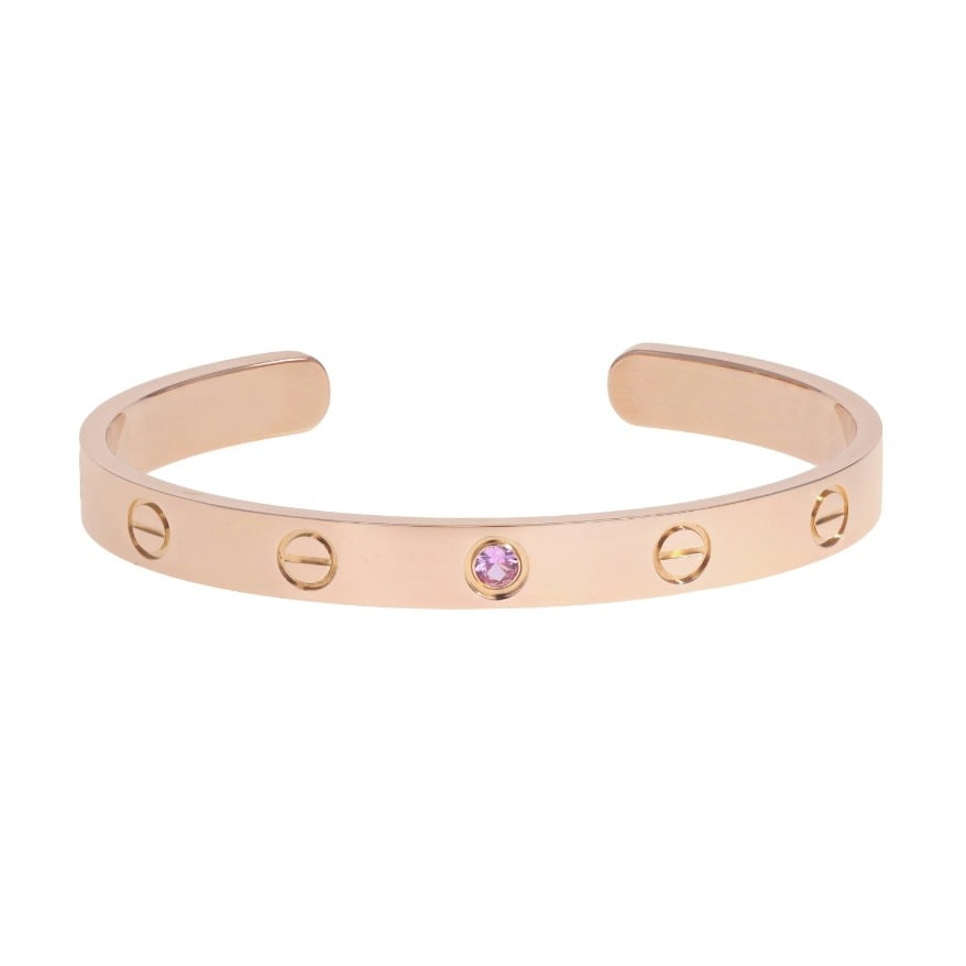 Cartier Love Cuff Bracelet: Cartier Love Cuff bracelet in 18K rose gold with pink sapphire, size 19, marked "Cartier 19, CV865 Au 750" Circumference: 7 in. 