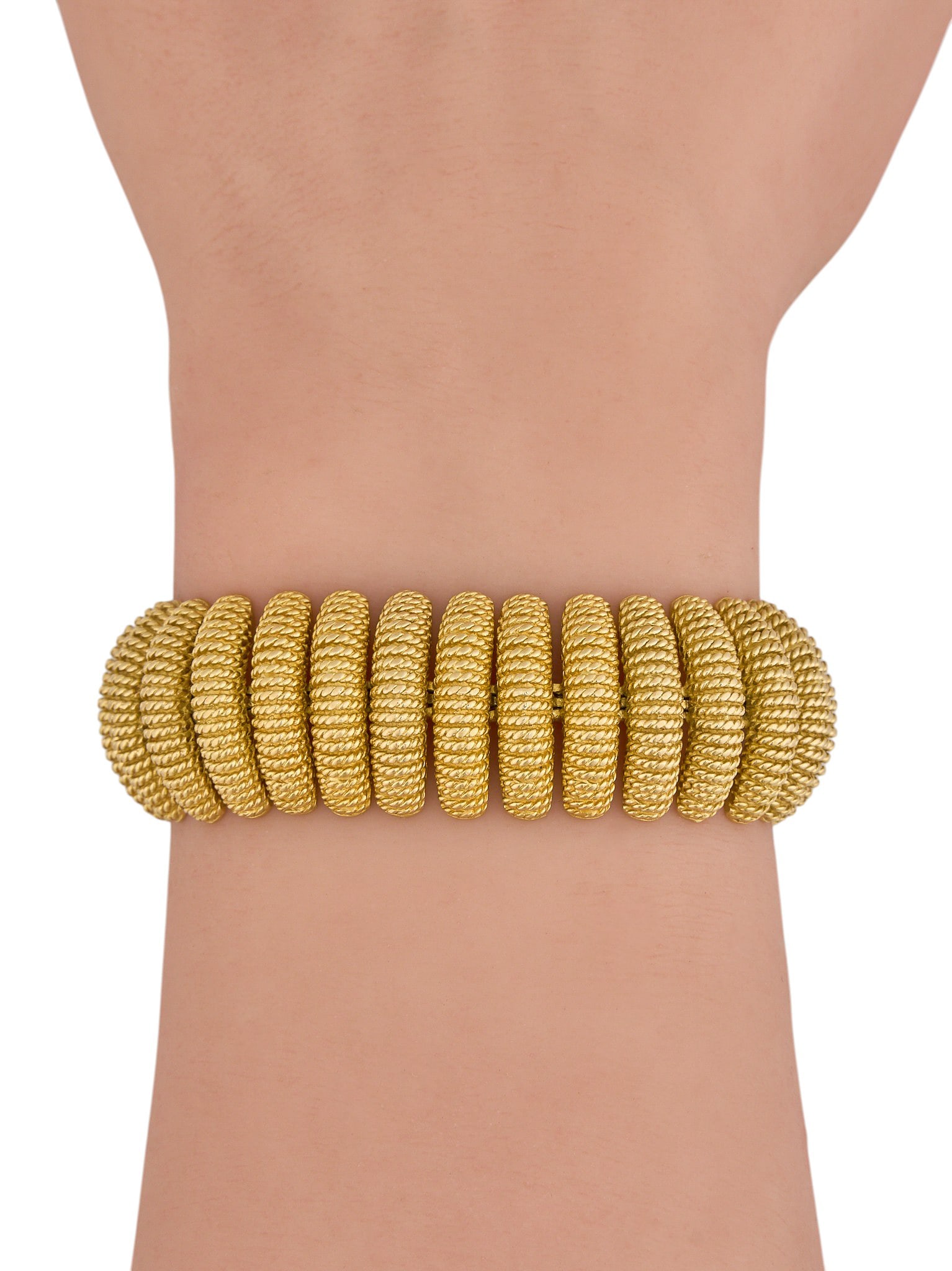 Tiffany & Co. 18K Gold Bracelet: Tiffany & Co. 18K yellow gold bracelet, with textured design, marked "Tiffany & Co. Italy 18K", with safety chain and extra links Length: 6.5 in. Total weight: 9.09 g