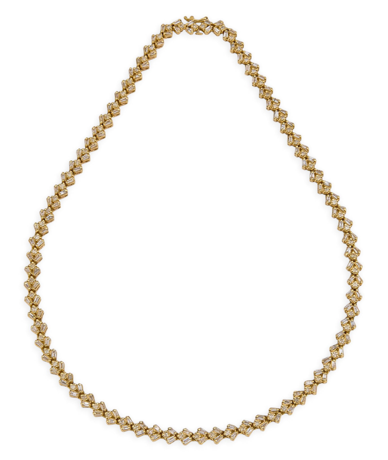 6 ct Diamond Tennis Necklace: 14K yellow gold (tested) princess length tennis necklace with seventy-nine round diamonds with G-I color and I2-I3 clarity and one hundred fifty-eight baguette diamonds with G-I color and I1-I2 clarit