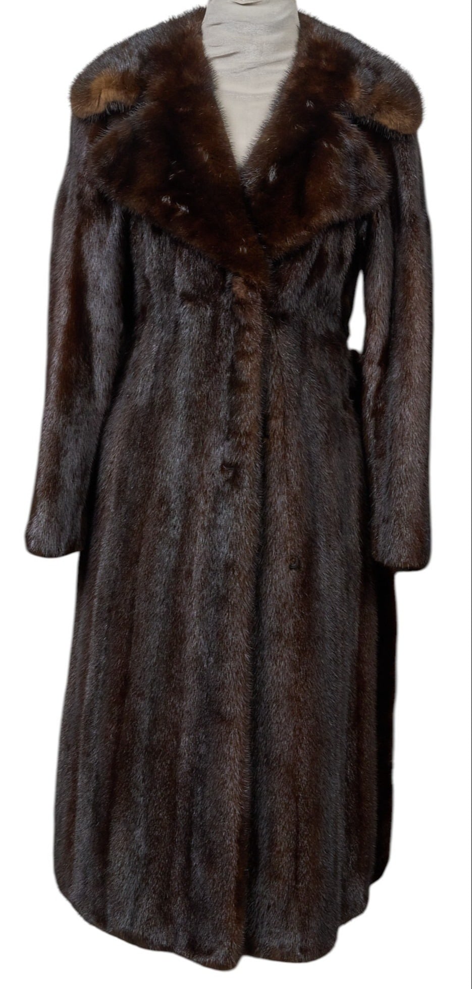 Vintage Mink Coat: Vintage Bonwit Teller mink coat with cross-body hook-and-eye closure, slit pockets, and waist tie length from top of collar: 45 in. shoulder width: 19 in. sleeve length: 23