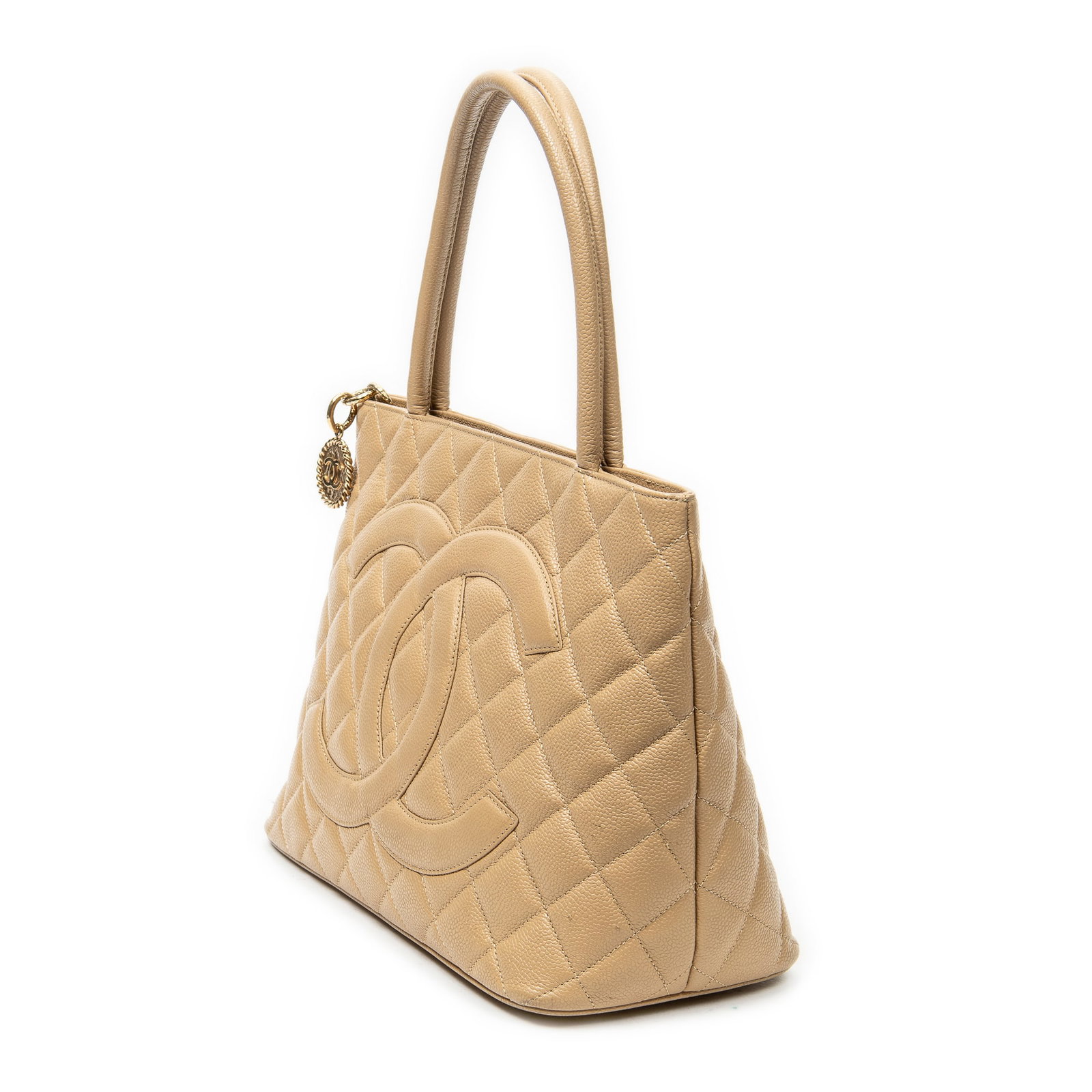 Chanel Timeless Medallion Tote Shoulder Bag: Chanel Timeless Medallion Tote shoulder bag in beige quilted caviar leather, gold hardware, marked 7250177 (2002-2003), includes dustbag; third-party authenticated 11.75 in. x 9.75 in. x 5.5 in.