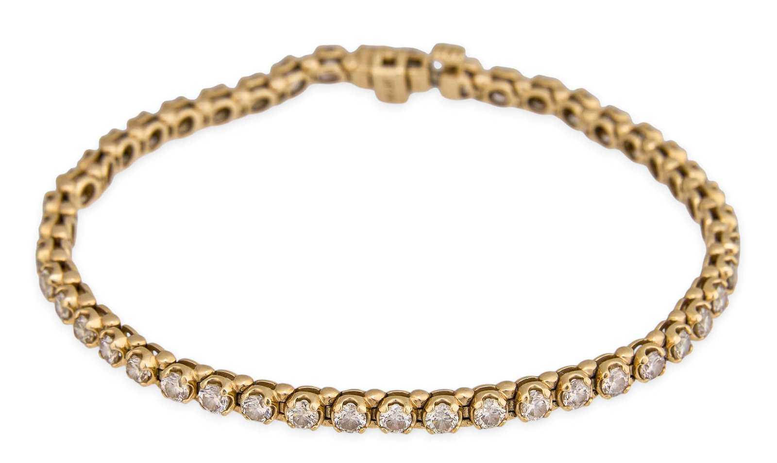 3.6 ctw Diamond Tennis Bracelet: 10K yellow gold and diamond tennis bracelet with open box closure, approximately 3.68 ctw, marked "10K JST" to clasp Length: 7 in. Total weight: 9.5 g Provenance: Property from a 