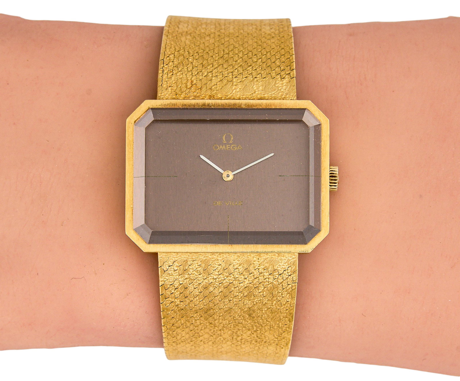 Omega 18K De Ville Watch: Omega 18K yellow gold De Ville watch, marked "IIII, 750" on clasp, 23mm x 33mm case Provenance: Property from the Cordillera Ranch home of prominent attorney David J. Arata