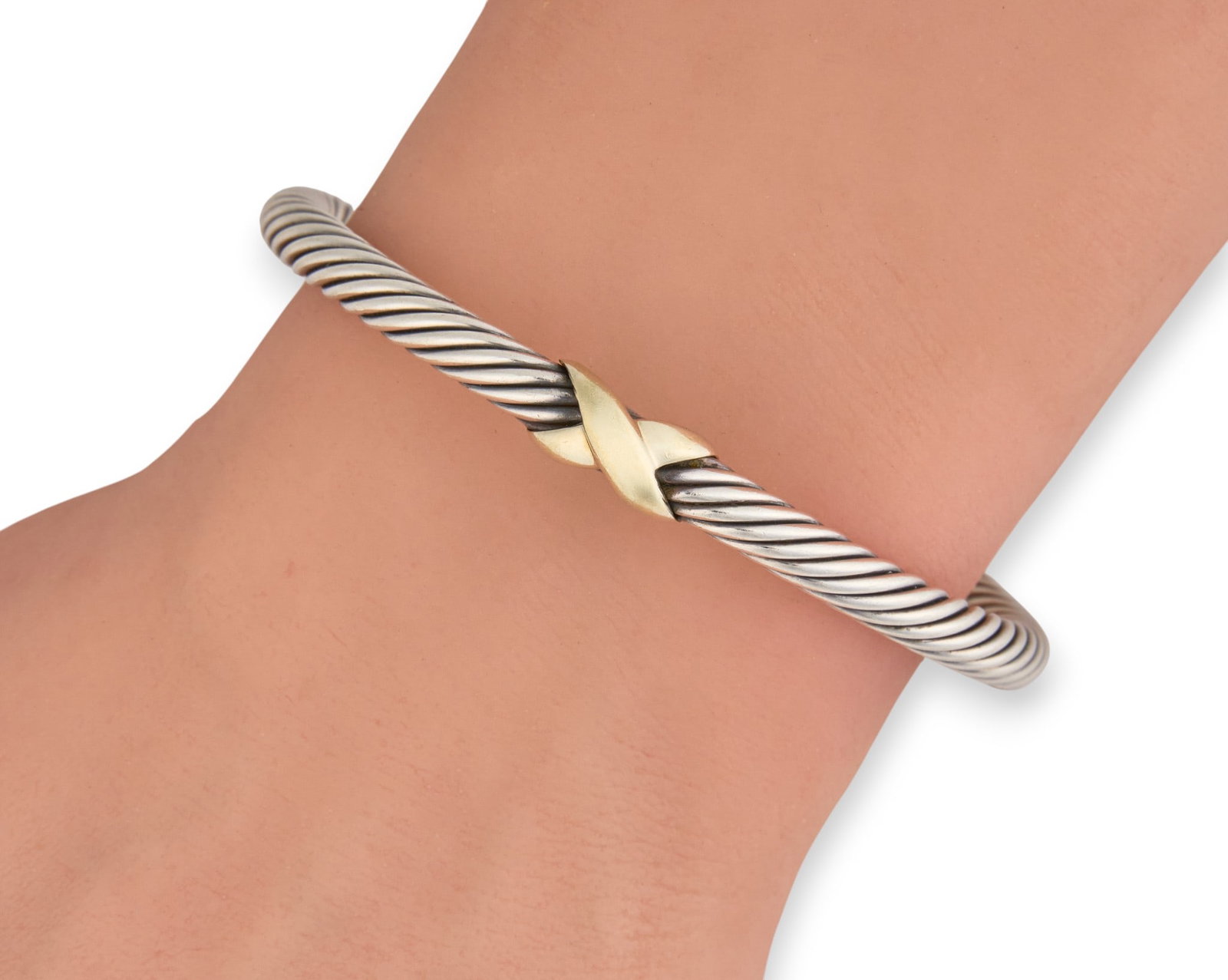 David Yurman 14K & Sterling Cuff Bracelet: David Yurman X classic cable station bracelet, sterling silver with 14K yellow gold end caps, marked "D.Y. 585 925" Circumference: 6.25 in. Total weight: 26.32 g Provenance: Property