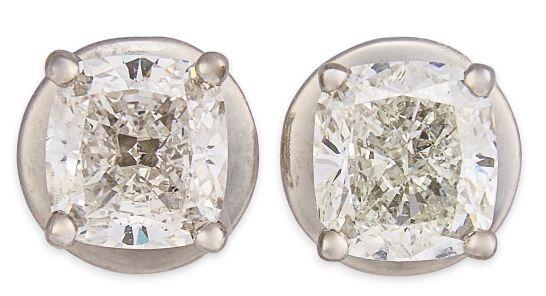 Platinum GIA Diamond Stud Earrings: Pair of platinum stud earrings, each set with a GIA certified cushion modified brilliant cut diamond weighing 0.7 ct, approximately 1.4 ctw, both diamonds are laser inscribed with their