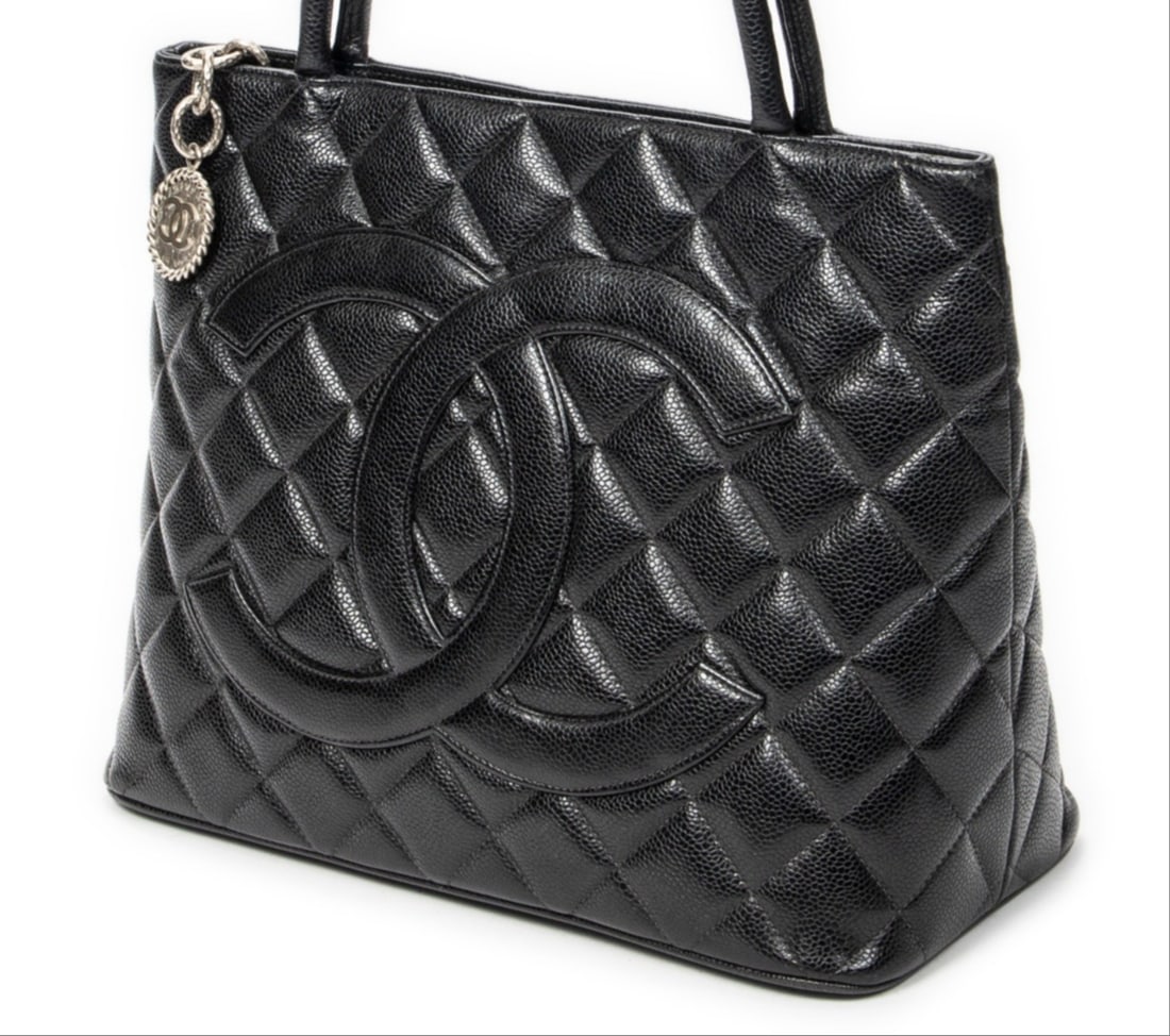 Chanel Timeless Medallion Tote Shoulder Bag: Chanel Timeless Medallion Tote shoulder bag in black quilted caviar leather, silver hardware, marked 6078998 (2000-2002); third-party authenticated 11.75 in. x 9.75 in. x 5.5 in. Condition A;