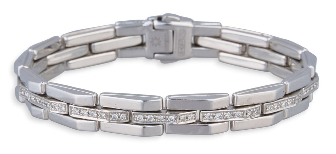 18K Diamond Bracelet: 18K white gold chain link bracelet, set with pave diamond links, marked "750" Length: 7 in. Total weight: 23.9 g Prov