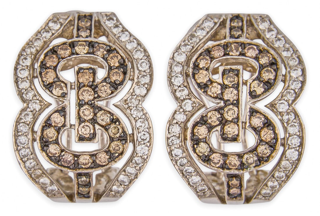 4 ctw Diamond Earrings: Pair of 18K white gold huggie style earrings, set with round brilliant cut diamonds, approximately 4.0 ctw, marked "18K 750" Size: 0.75 in. / length Total weight: 8.59 g Provenance: