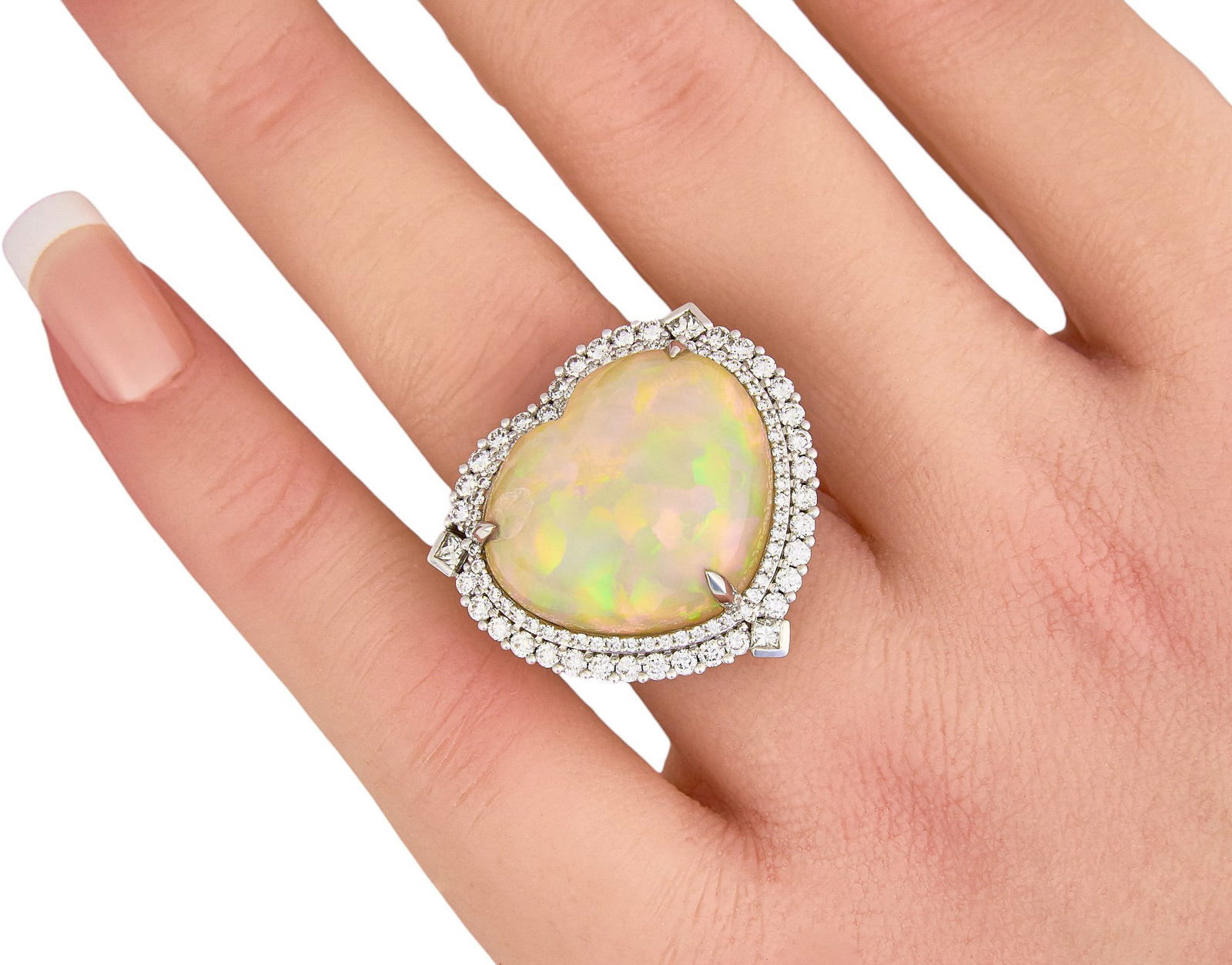 Chromia 18K Heart Opal and Diamond Ring: Chromia 18K white gold ring centering a heart-shaped cabochon opal measuring approximately 17.40 x 20.70 mm, accented by a pierced halo of round brilliant and princess cut diamonds totaling approximat