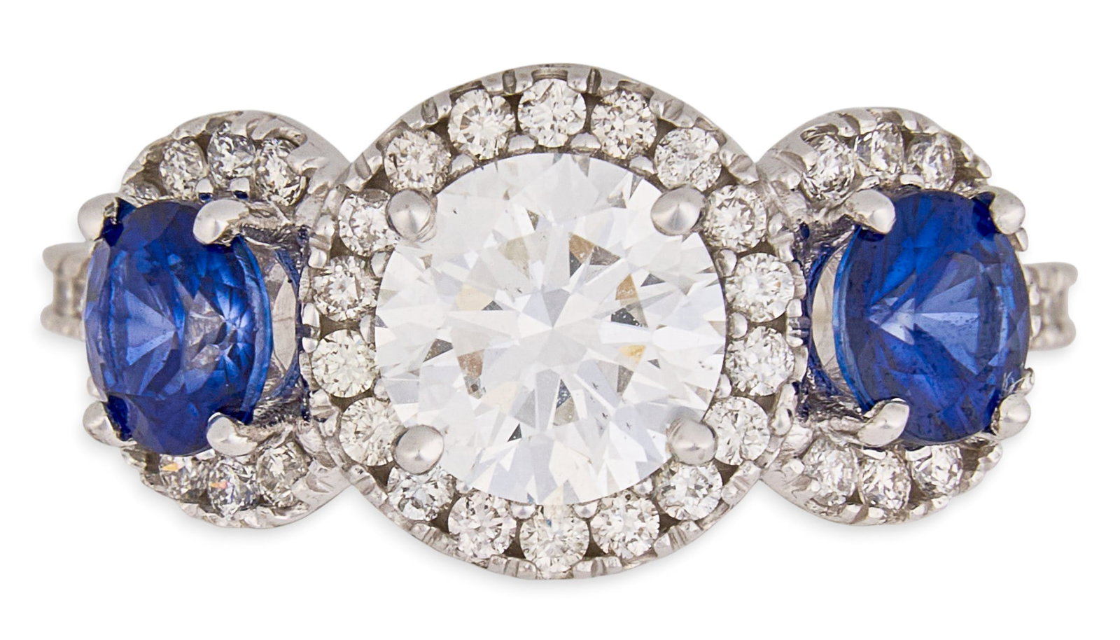 14K Diamond & Sapphire Ring: 14K white gold ring set with lab grown diamond center stone, approximately 1.19 ct, flanked by two natural sapphires, approximately 1.17 ctw, accented by triple halo of round brilliant cut diamon