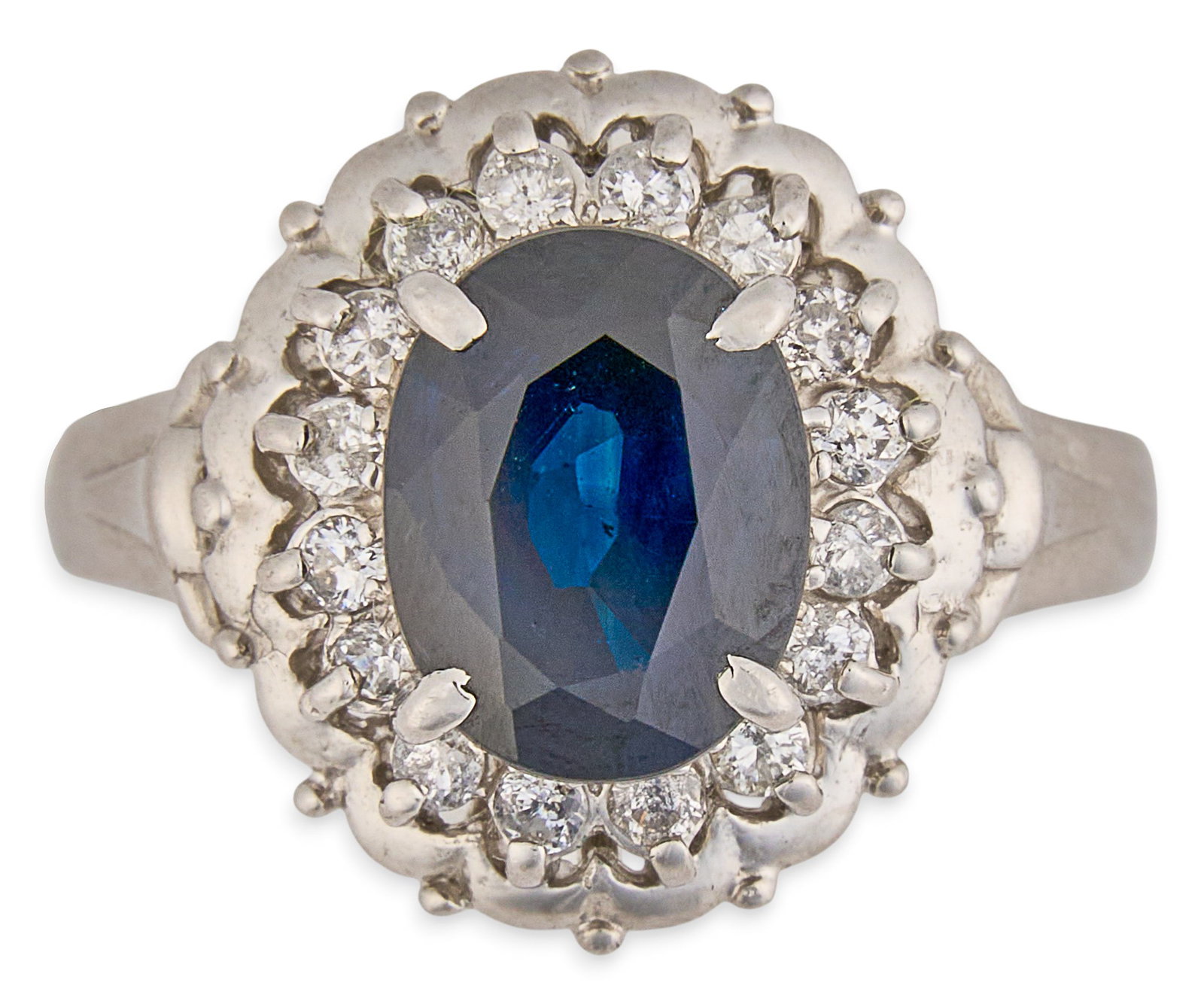 Platinum Sapphire & Diamond Ring: Platinum ring set with oval cut sapphire, approximately 2.27 ct, accented by diamond halo of round brilliant cut diamonds, approximately 0.27 ctw, marked "Pt900" and "2.27 0.27" Si