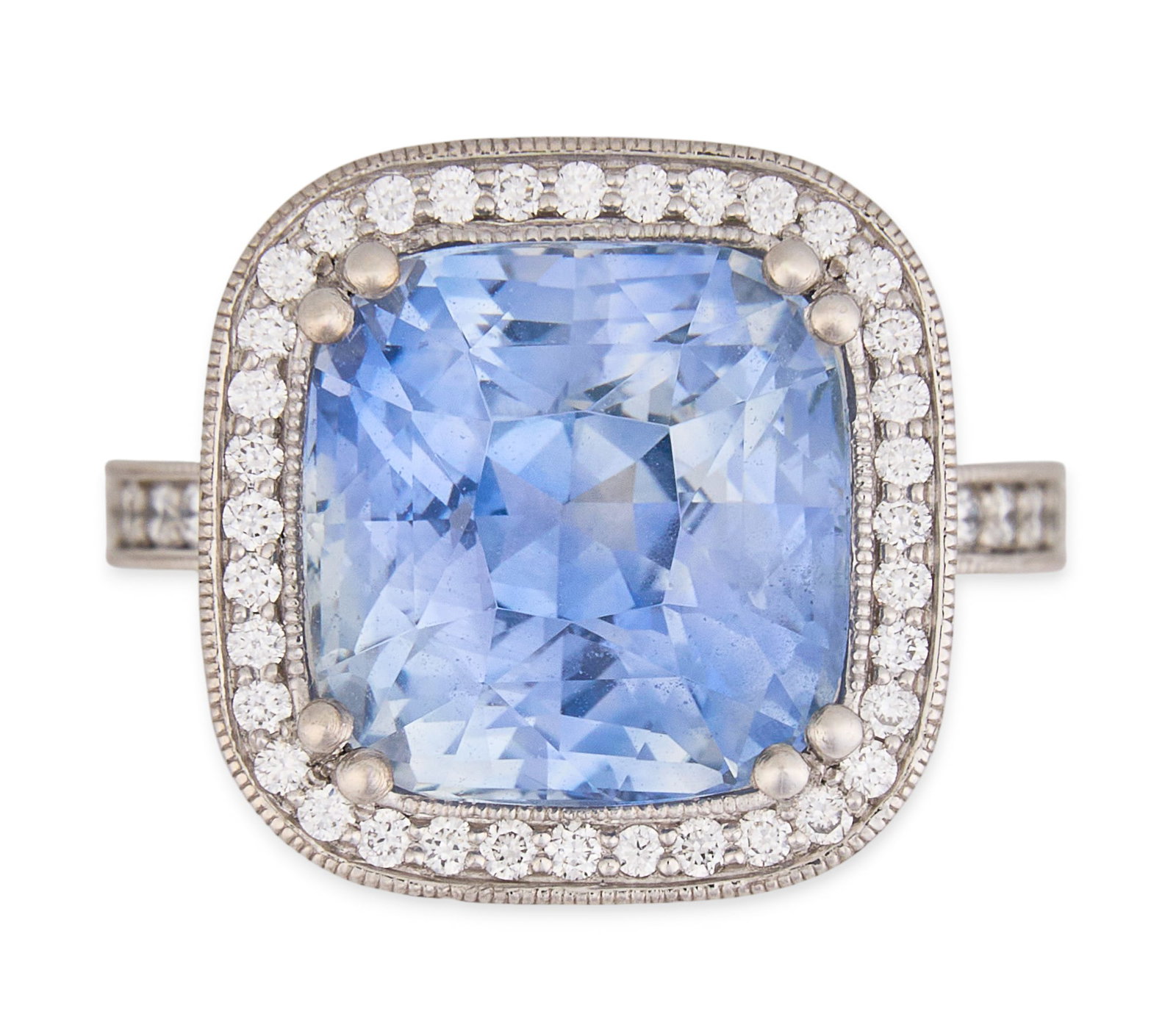 Impressive GIA 10.05 CT Ceylon Sapphire & Diamond Ring: Platinum ring set with 10.05 ct unheated ceylon sapphire and halo of round brilliant cut diamonds, with additional round brilliant cut diamonds to shank, approximately 0.92 ctw, F-G color and VS1