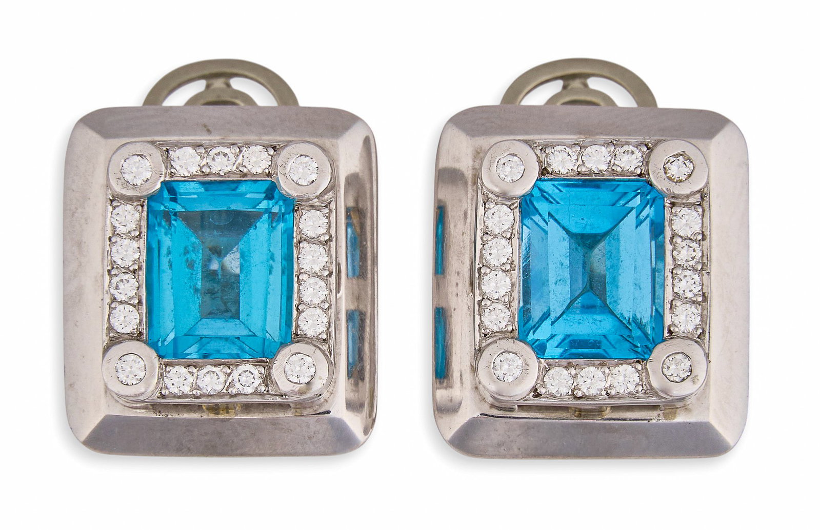 14K Blue Topaz & Diamond Earrings: Pair of vintage 14K white gold earrings set with emerald cut blue topaz center stones, accented by round brilliant cut diamonds, averaging F-G color and VS clarity, marked "Bossa 14K Toronto"