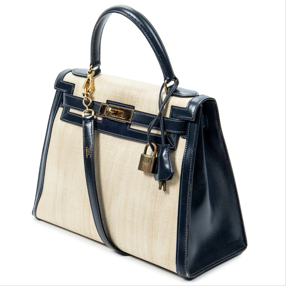 Hermes Rare Vintage Kelly Sellier Bicolor 28 Shoulder Bag: Hermes Rare Vintage Kelly Sellier Bicolor 28 shoulder bag in beige/navy crinoline, navy leather handles, gold hardware, marked Stamp Q in circle (1987), includes strap, cadenas, keys in clochette, dus