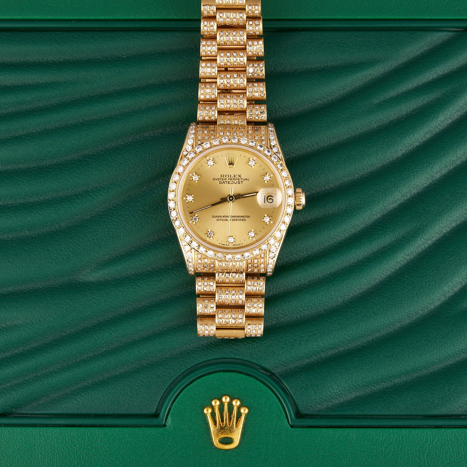 Ladies Rolex Datejust 31 mm 18K Gold: Ladies Rolex Datejust Oyster Perpetual 18K yellow gold watch, 31mm case, champagne dial with diamond hour markers, diamond set bezel, case and President bracelet, includes original box and Rolex 