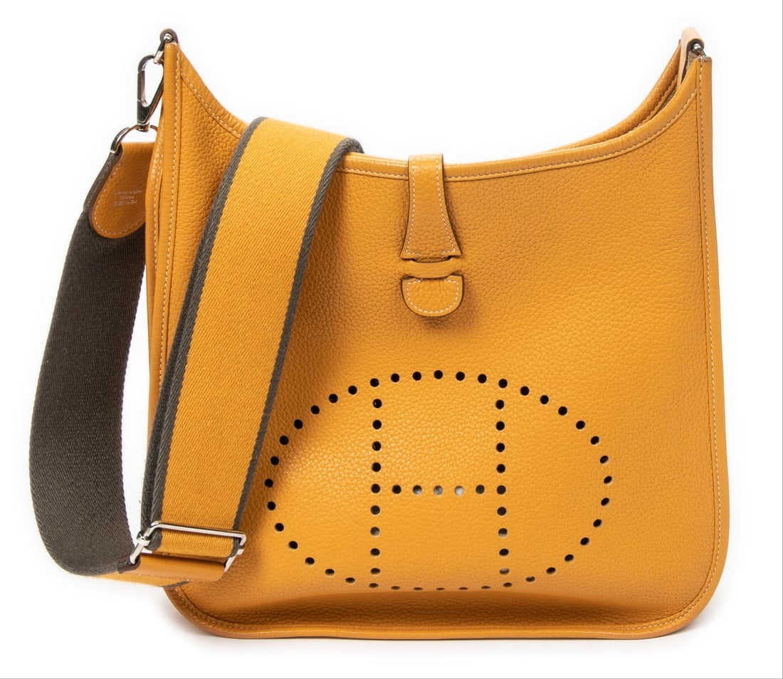 Hermès Evelyne III PM Shoulder Bag: Hermès Evelyne III PM shoulder bag in moutarde Clemence leather, palladium hardware, marked Stamp P in Square (2012), includes long strap; third-party authenticated 11.5 in. x 11.75 in. x 3.25 