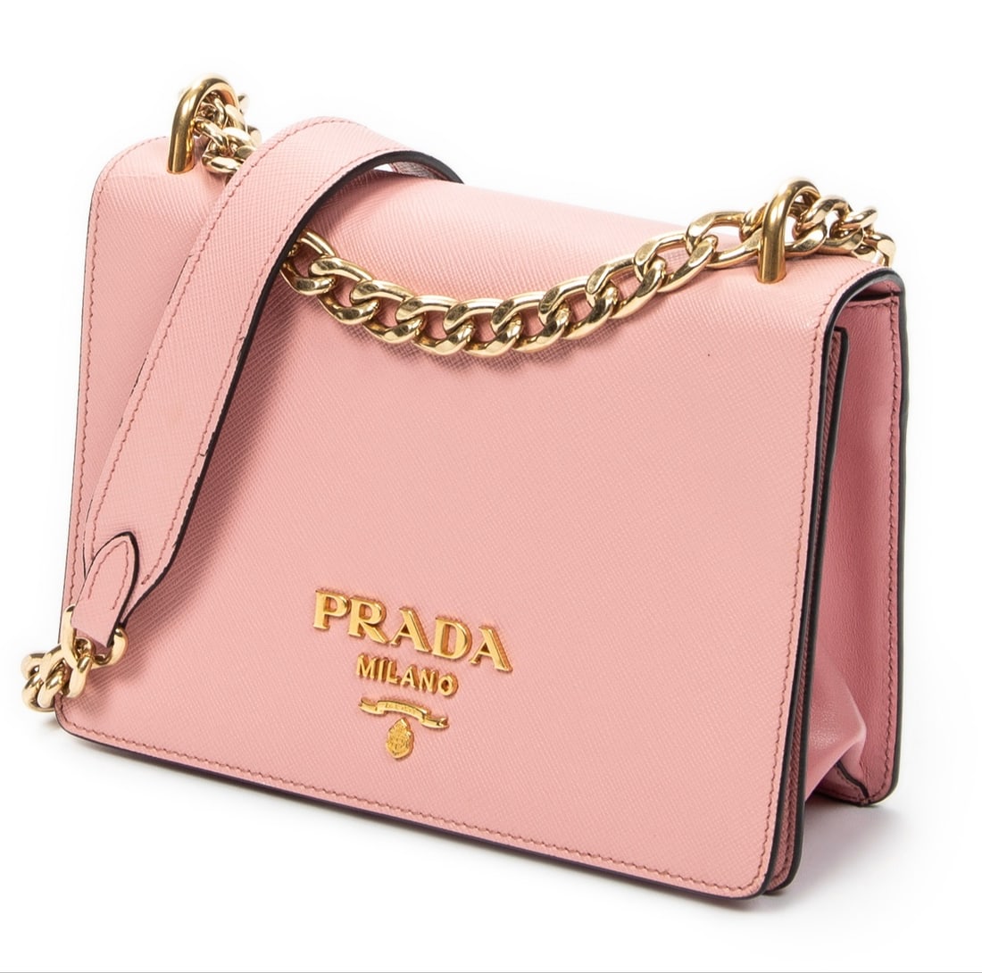 Prada Full Flap Crossbody Shoulder Bag: Prada Full Flap Crossbody shoulder bag in pink saffiano leather, gold hardware, marked 256; third-party authenticated 7.75 in. x 5.5 in. x 1.5 in. Condition A; excellent condition, shows little signs