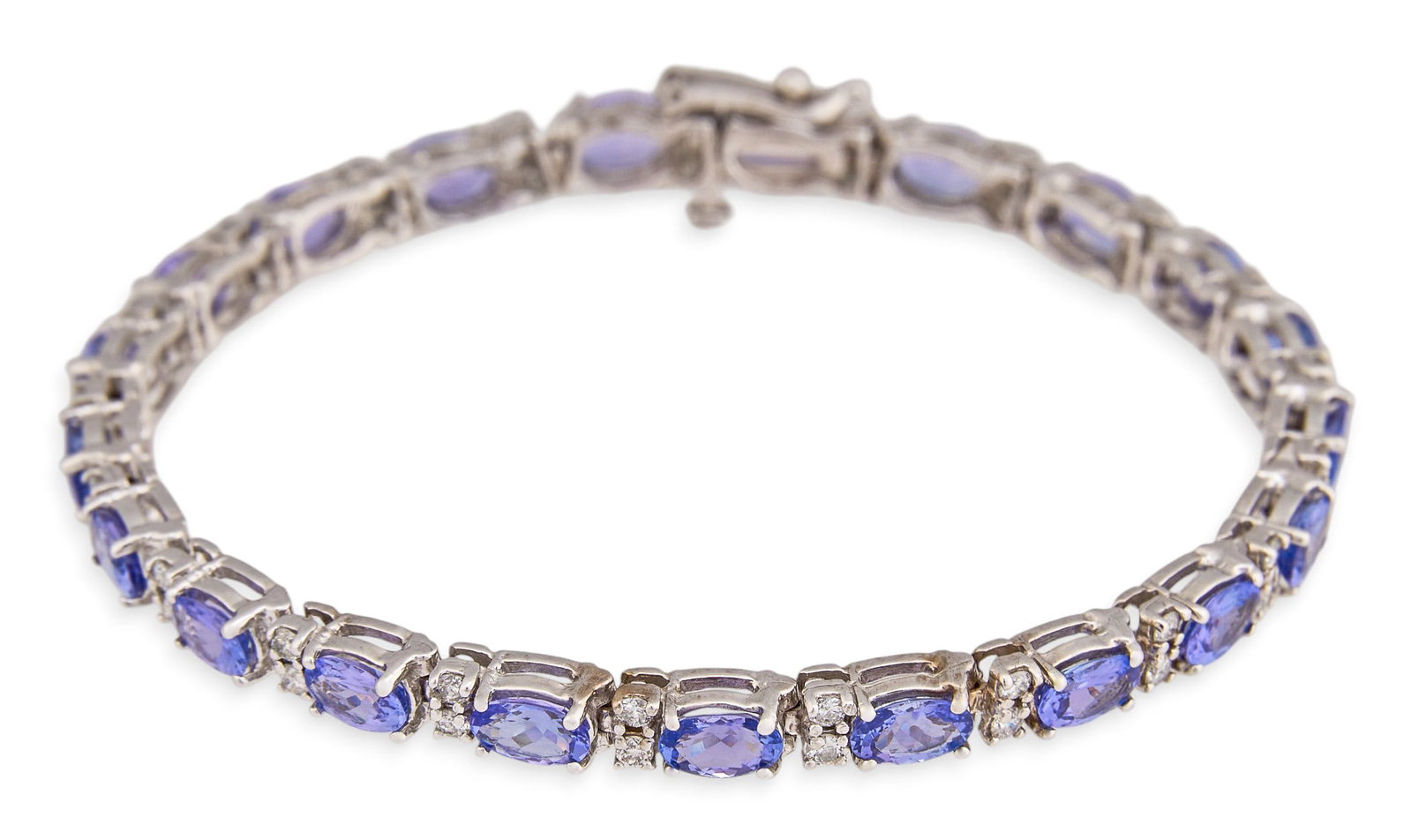 14K Tanzanite & Diamond Tennis Bracelet: 14K white gold tennis bracelet, set with alternating oval cut tanzanite and round brilliant cut diamonds, marked "14K" to clasp Length: 7.25 in. Total weight: 13.1 g Provenance: Property