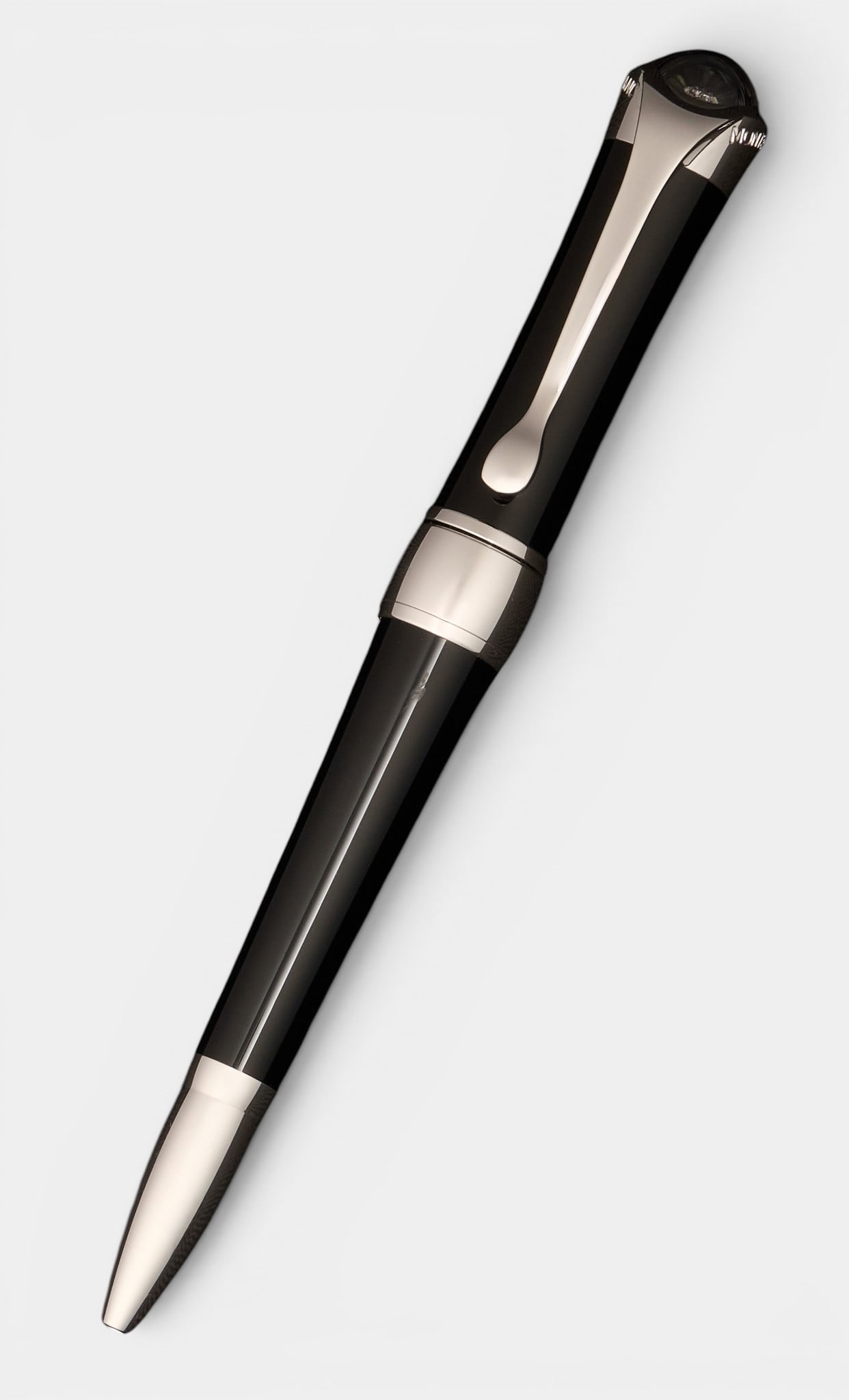 Montblanc Floating Diamond Pen: Montblanc Etoile ballpoint pen, the black resin body with silver coloured clip and banding, stamped Montblanc, the domed terminal with inset floating diamond Provenance: Property from a home in San An