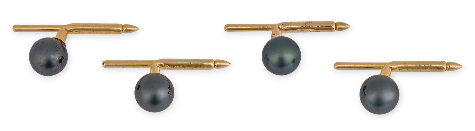 (4) 14K Tahitian Pearl Shirt Studs: Four 14k yellow gold shirt studs with Tahitian pearl settings, marked "535" Total weight: 8.3 g Provenance: Property from the custom chilled cellar of the Cordillera Ranch h