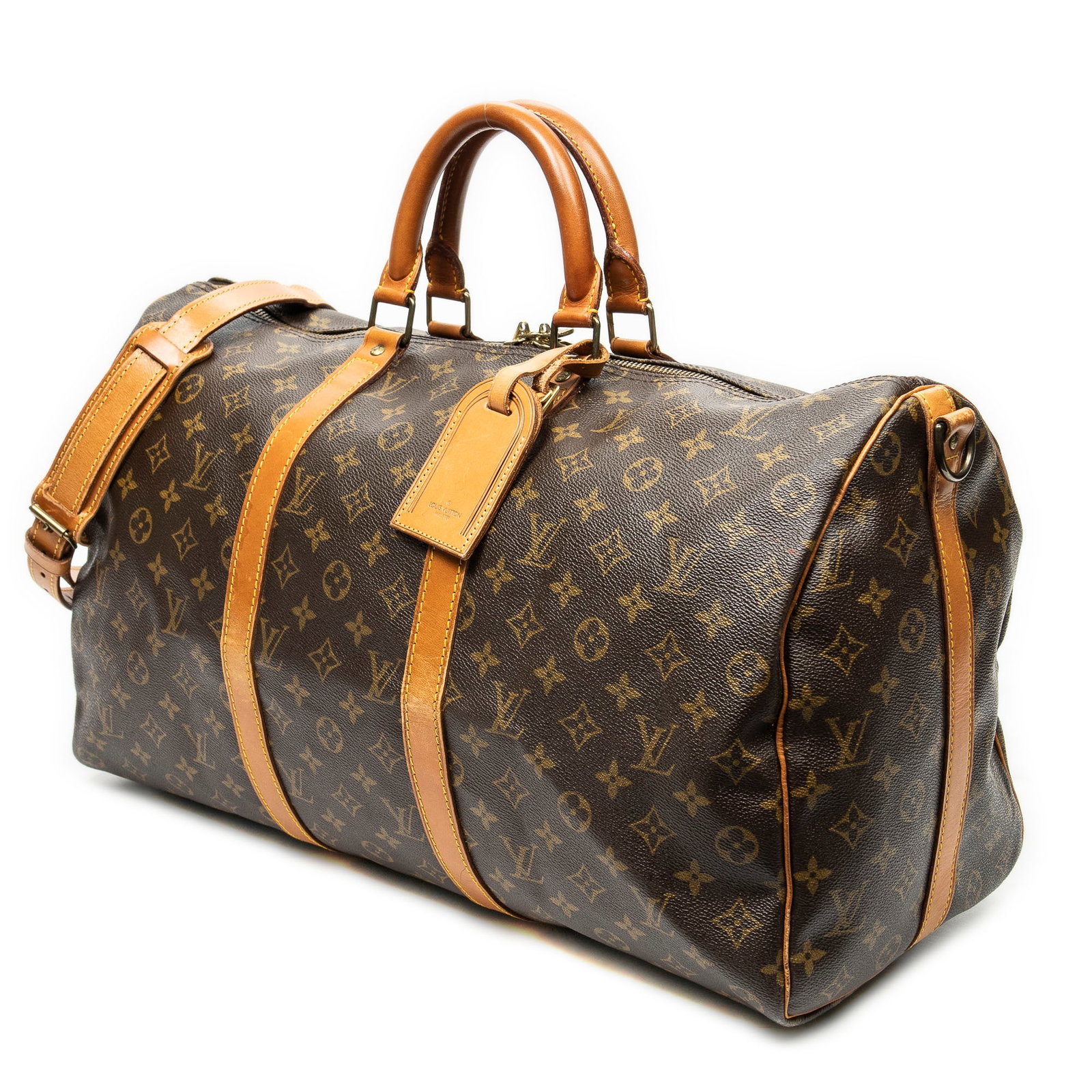 Louis Vuitton Keepall Bandouliere 50 Travel Bag: Louis Vuitton Keepall Bandouliere 50 travel bag in brown monogram canvas, vachetta handles, golden brass hardware, marked 883FC (March 1988), includes long strap, luggage tag; third-party authenticate