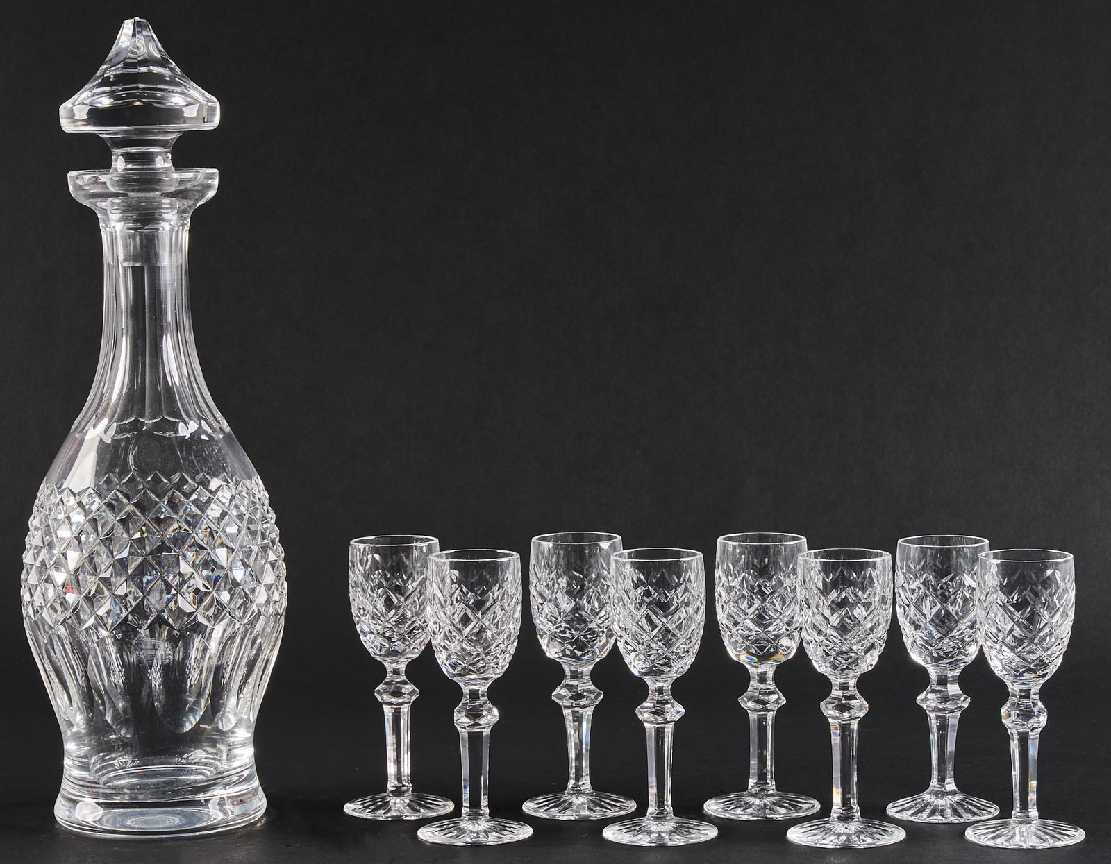 Waterford Decanter & (8) Cordials: Waterford cut crystal decanter with eight cordials height 13 in. / decanter height 4.75 in. / cordial Provenance: Property from a home in San Antonio, Texas
