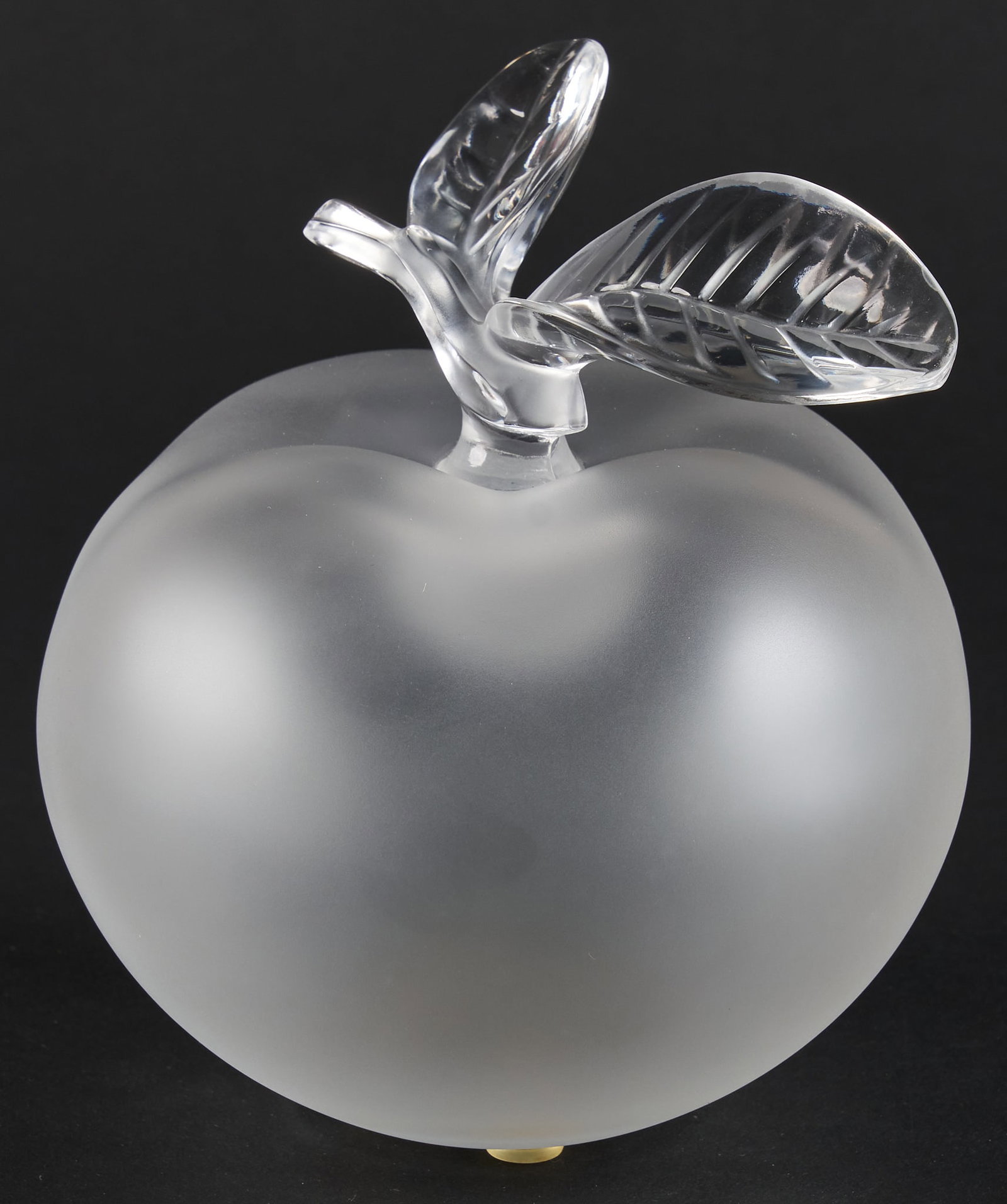 Lalique Nina Ricci Apple Perfume Bottle: Lalique Nina Ricci Apple frosted glass perfume bottle, signed on bottom height 6 in. x width 5 in. x depth 5 in. Provenance: Property from a home in San Antonio, Texas