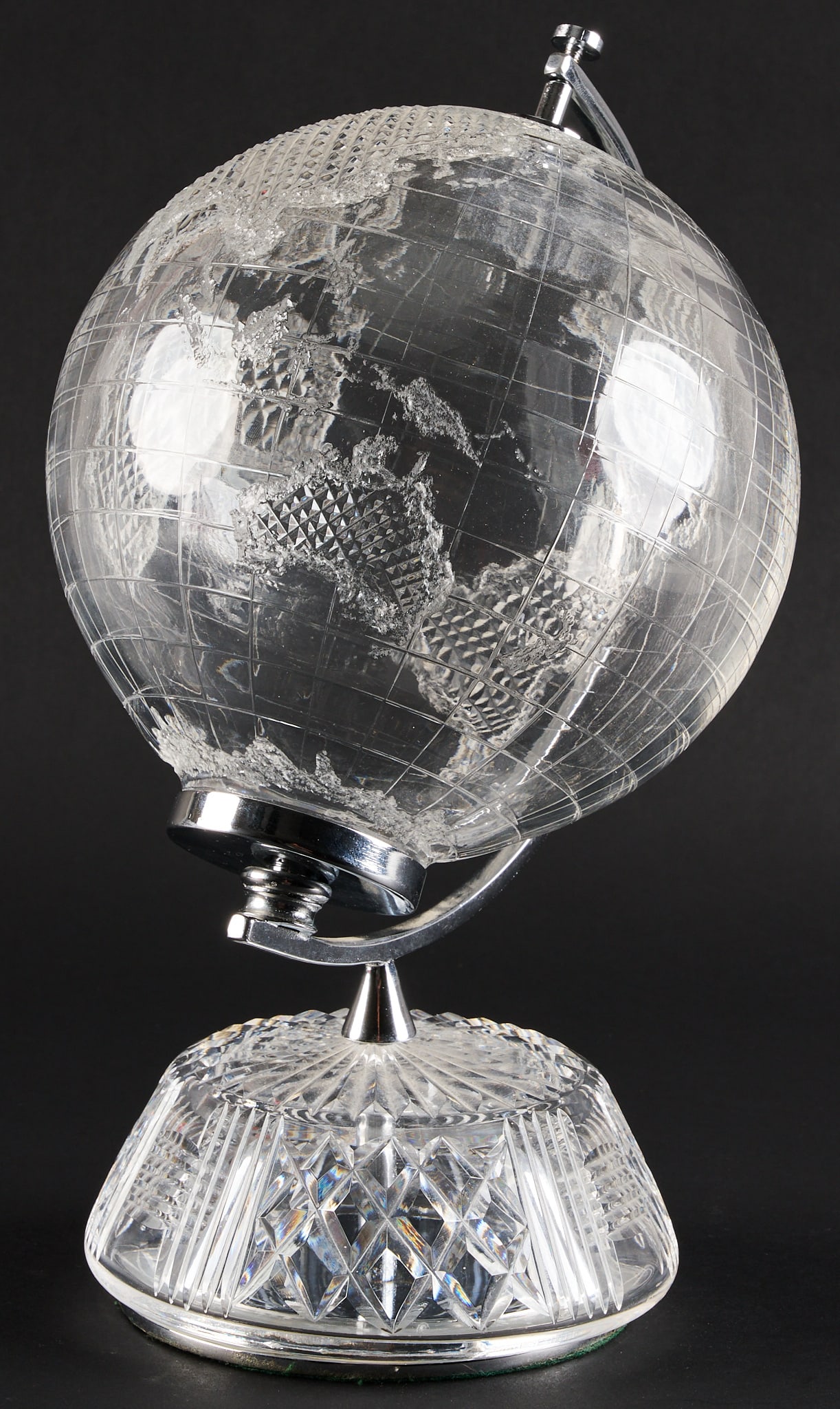 Retired Limited Edition Waterford Crystal Globe: Retired limited edition Waterford rotating hollow cut crystal globe with chrome and glass stand height: 12 in. x width 6 in. x depth 6 in. Provenance: Property from the collection of an industri