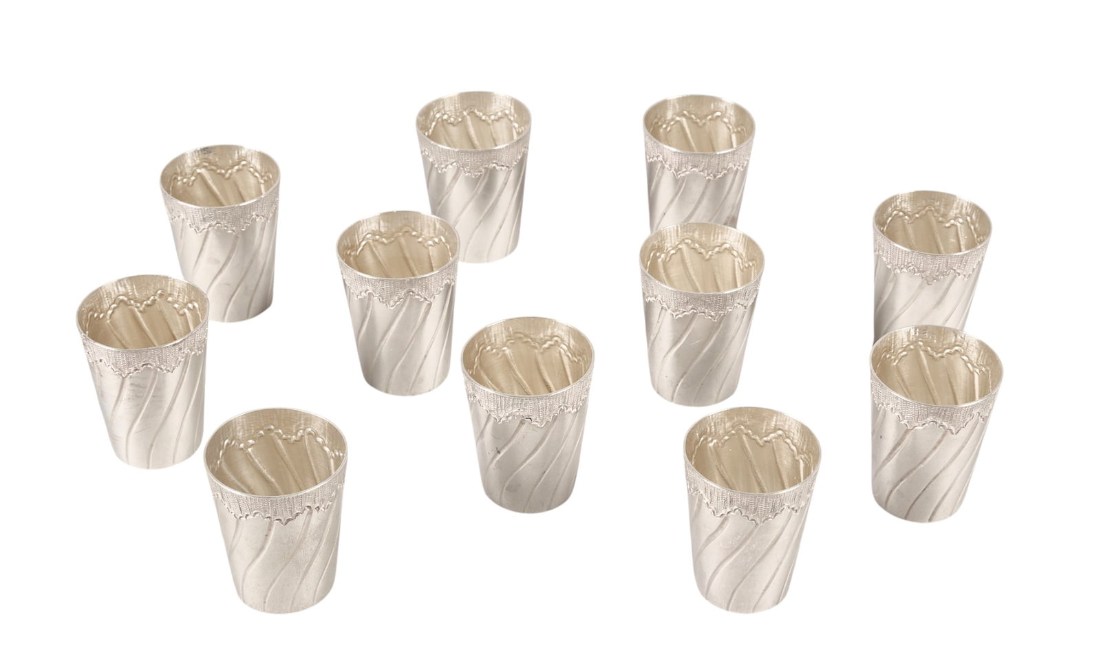 (11) Carl Frey & Söhne Sterling Silver Shot Glasses: Eleven Carl Frey and Söhne sterling silver shot glasses height 1.75 in. x diameter 1 in. Total weight: 9.54 ozt weighable silver Provenance: Property from the collectio