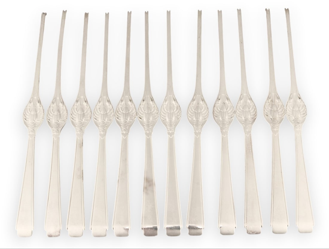 (12) Sterling Silver Lobster Picks: Twelve sterling silver lobster picks length 7.5 in. / each Total weight: 12.485 ozt weighable silver Provenance: Property from the collection of an industrial chemicals entrepreneur, from his