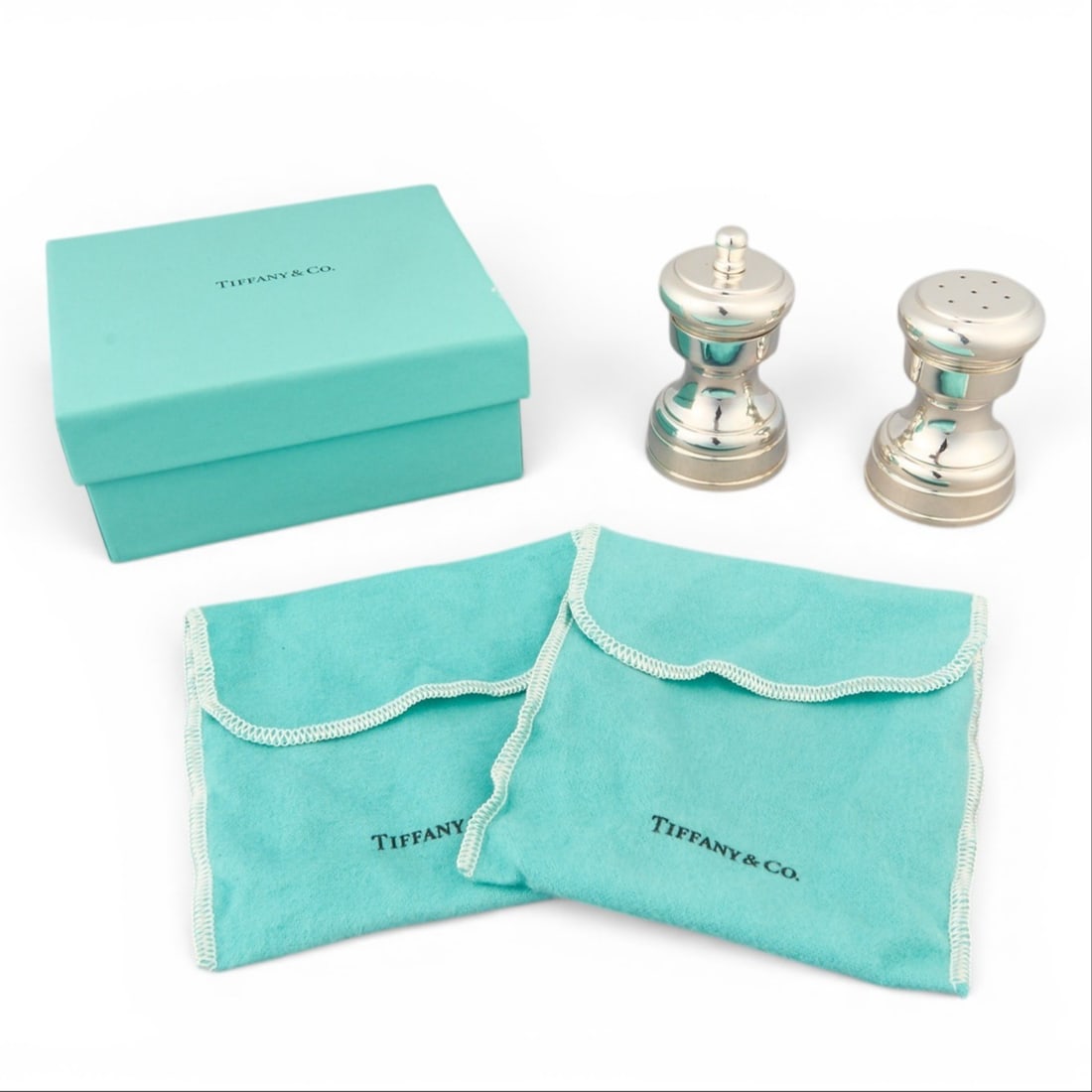 Tiffany & Co. Sterling Silver Salt Shaker and Pepper Mill: Tiffany & Co. sterling silver salt shaker and pepper mill, with original box, marked "Tiffany & Co." height 3 in. x width 1.75 in. x depth 1.75 in. / largest Total weight: