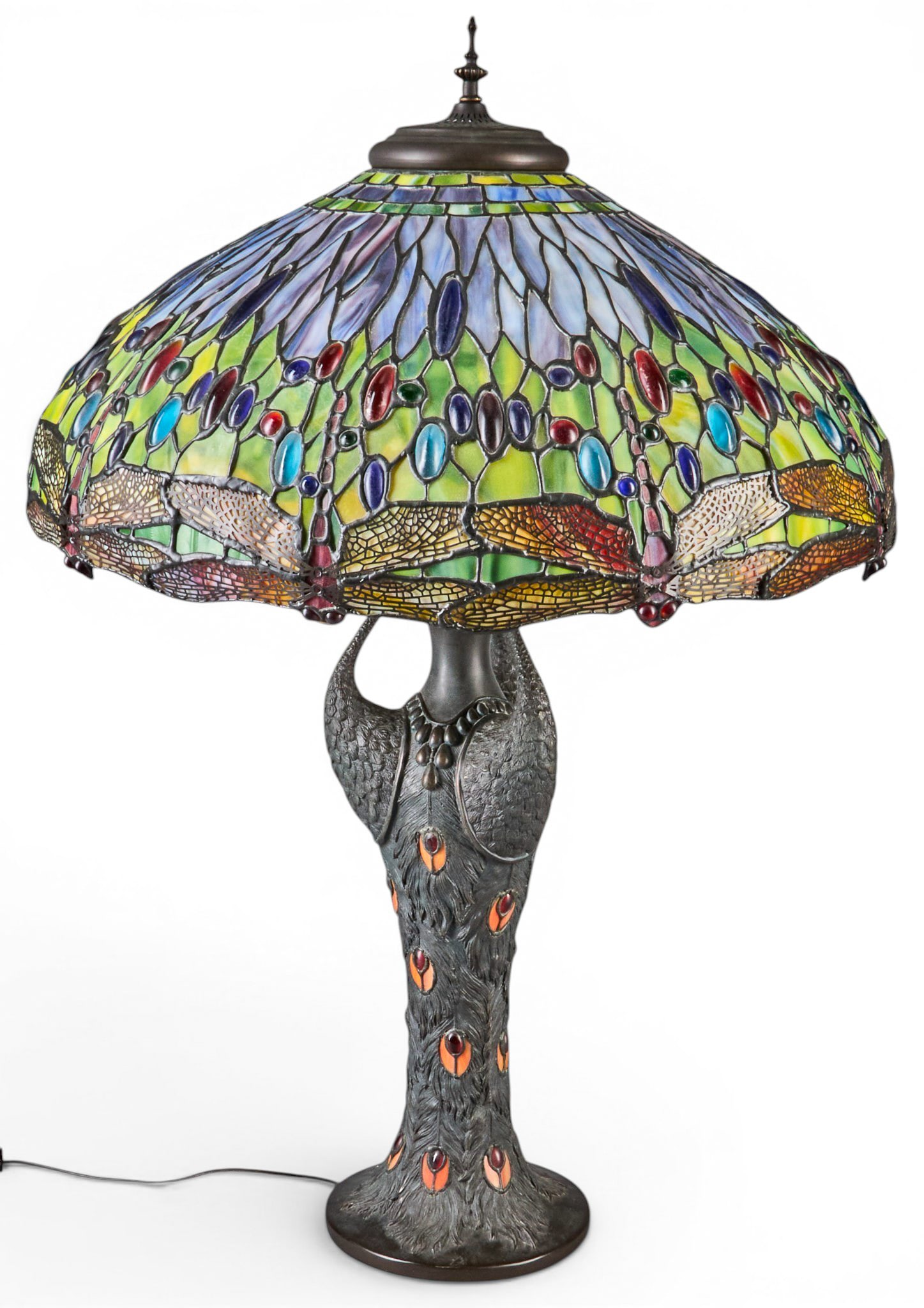 Tiffany Style Table Lamp: Tiffany style table lamp with slag glass shade, depicting dragonfly motifs, on metal base with peacock motifs, three bulbs, in working condition height 35 in. x diameter 21 in. Provenance: Property