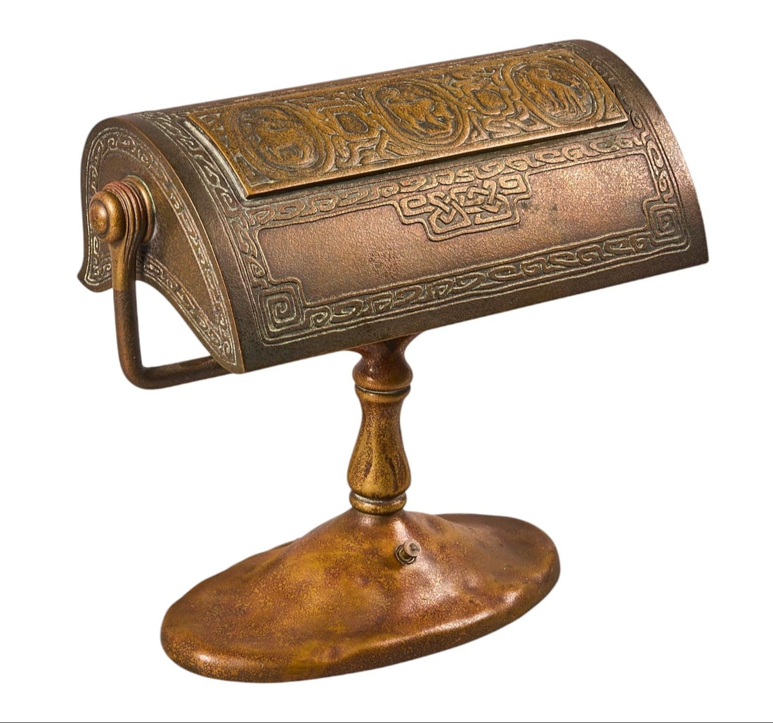 Tiffany Studios Zodiac Desk Lamp: Tiffany Studios Zodiac bronze desk lamp, marked "Tiffany Studios, New York, 414" underneath, in working condition height 9.25 in. x width 11 in. x depth 5 in. Provenance: Property