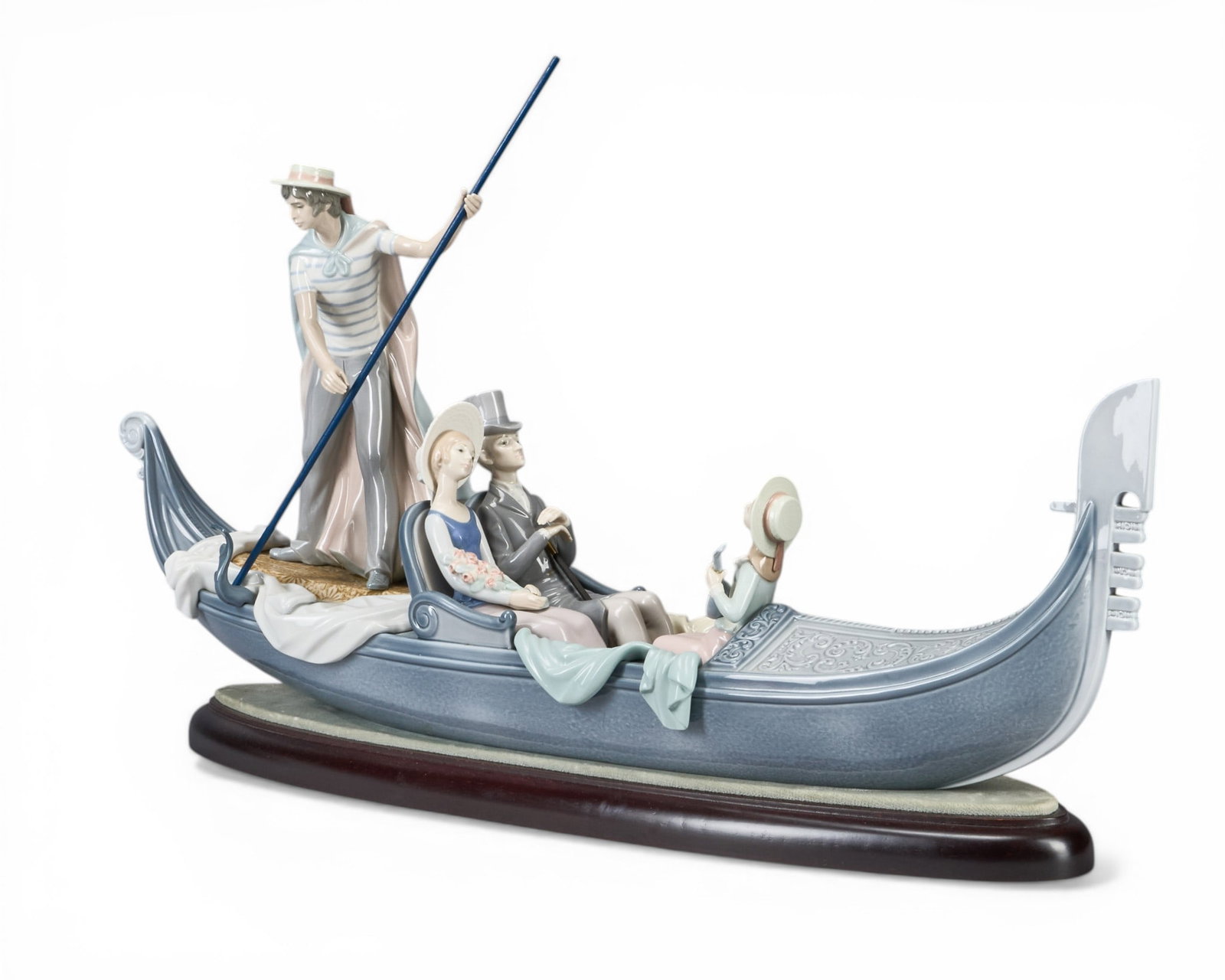 Lladro, In the Gondala: Lladro "In the Gondala" porcelain sculpture, marked underneath, with wooden base height 16.5 in. x width 30.5 in. x depth 6 in. Provenance: Property form a home in Boerne, Texas
