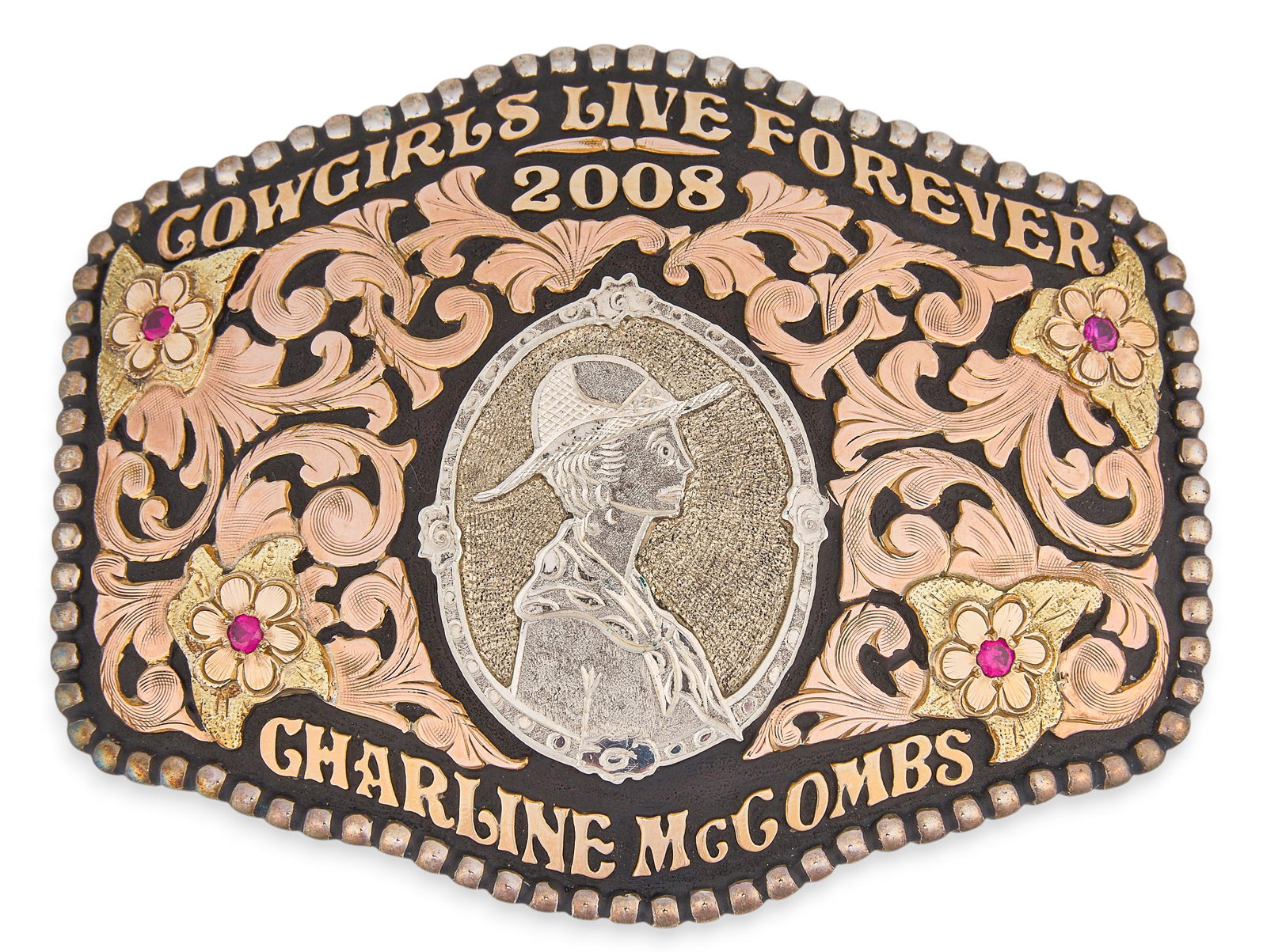 Red McCombs | Charline McCombs Cowgirl Belt Buckle: Sterling silver belt buckle by Hyo Silver, featuring 10K gold filled overlay with floral motifs and ruby accents, inscribed "Cowgirls Live Forever 2008" and "Charlene McCombs" Size