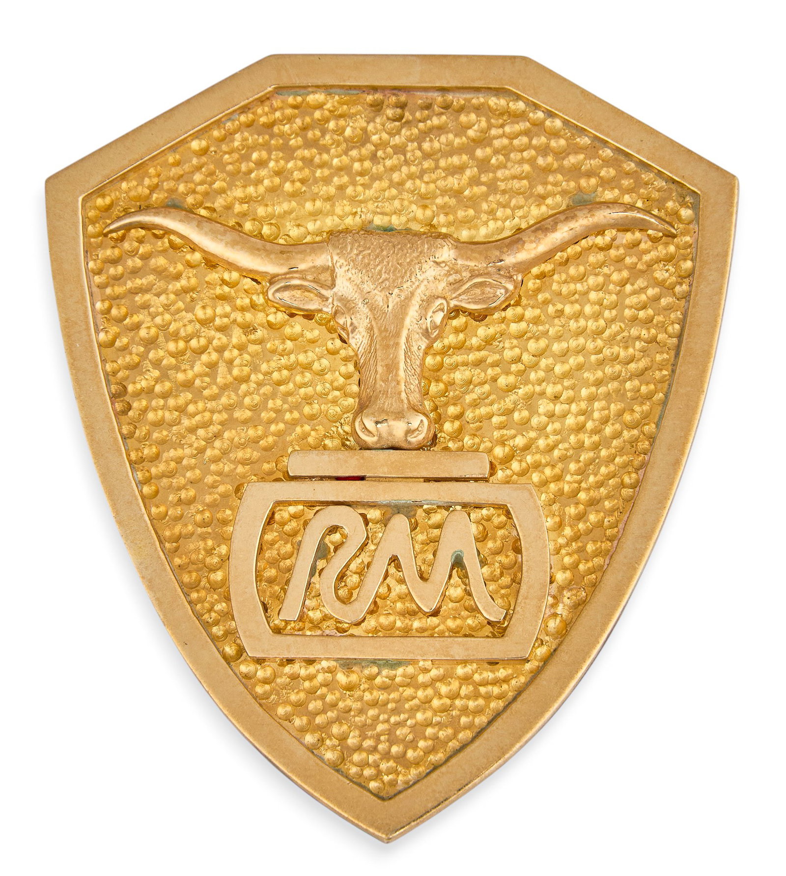 Red McCombs | 14K RM Longhorn Bolo Slide: 14K gold shield-shaped bolo slide, with central longhorn head motif above "RM" initials, hammered finish, marked "14K" Size: 1 7/8 in. x 1.5 in. Total weight: 24.0 g Prov