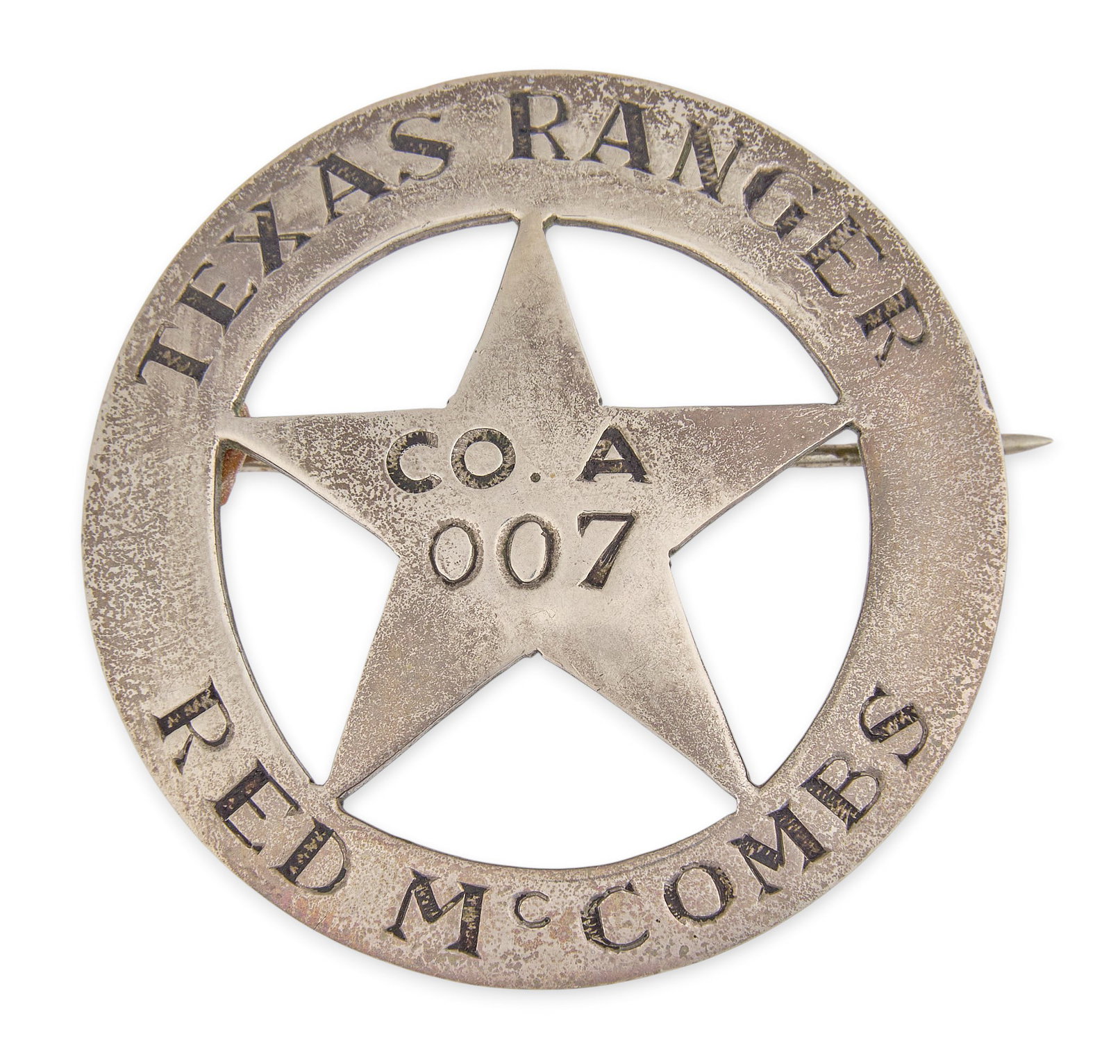 Red McCombs | Texas Ranger Badge: Honorary Texas Rangers badge made for Red McCombs, composed of Mexican cinco peso, pierced Texas star motif Size: 1.5 in. / diameter Total weight: 18.8 g