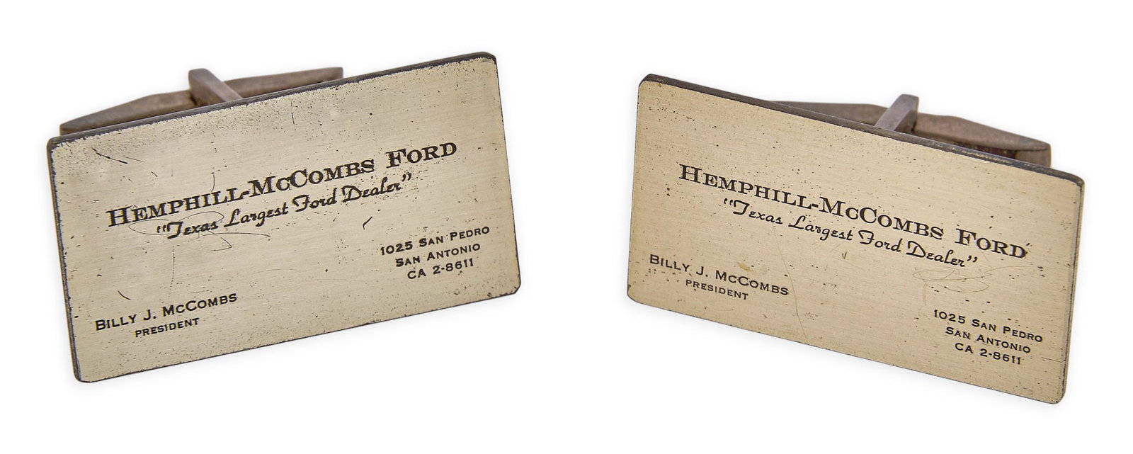 Red McCombs | Sterling Silver Business Card Cufflinks: Pair of sterling silver cufflinks depicting miniature replica business cards belonging to President Billy J. McCombs at Hemphill-McCombs Ford, marked "Sterling" Size: 1 1/8 in. x 5/8 in