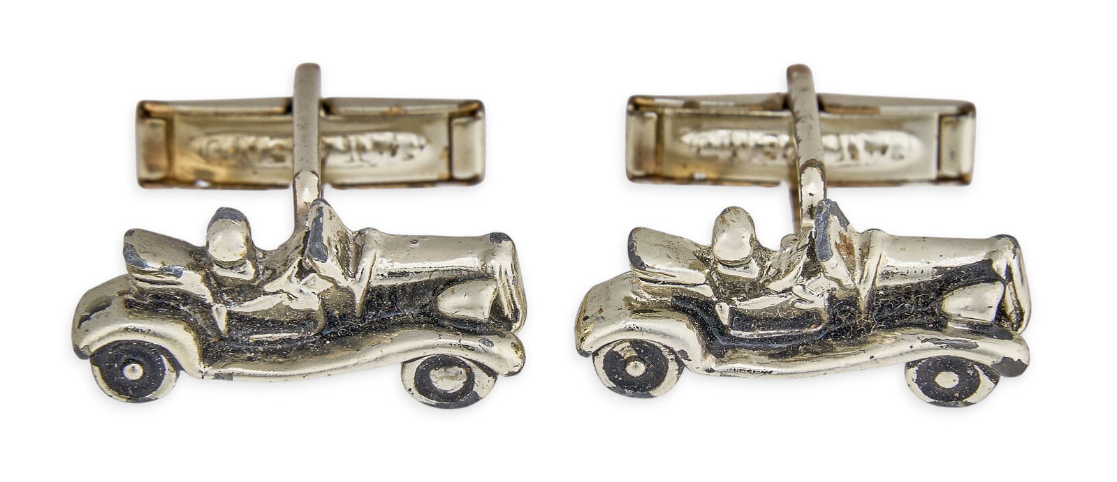 Red McCombs | Antique Car Cufflinks: Pair of antique cufflinks designed as miniature cars, featuring toggle backs Size: 7/8 in. x 3/8 in. Total weight: 9.4 g