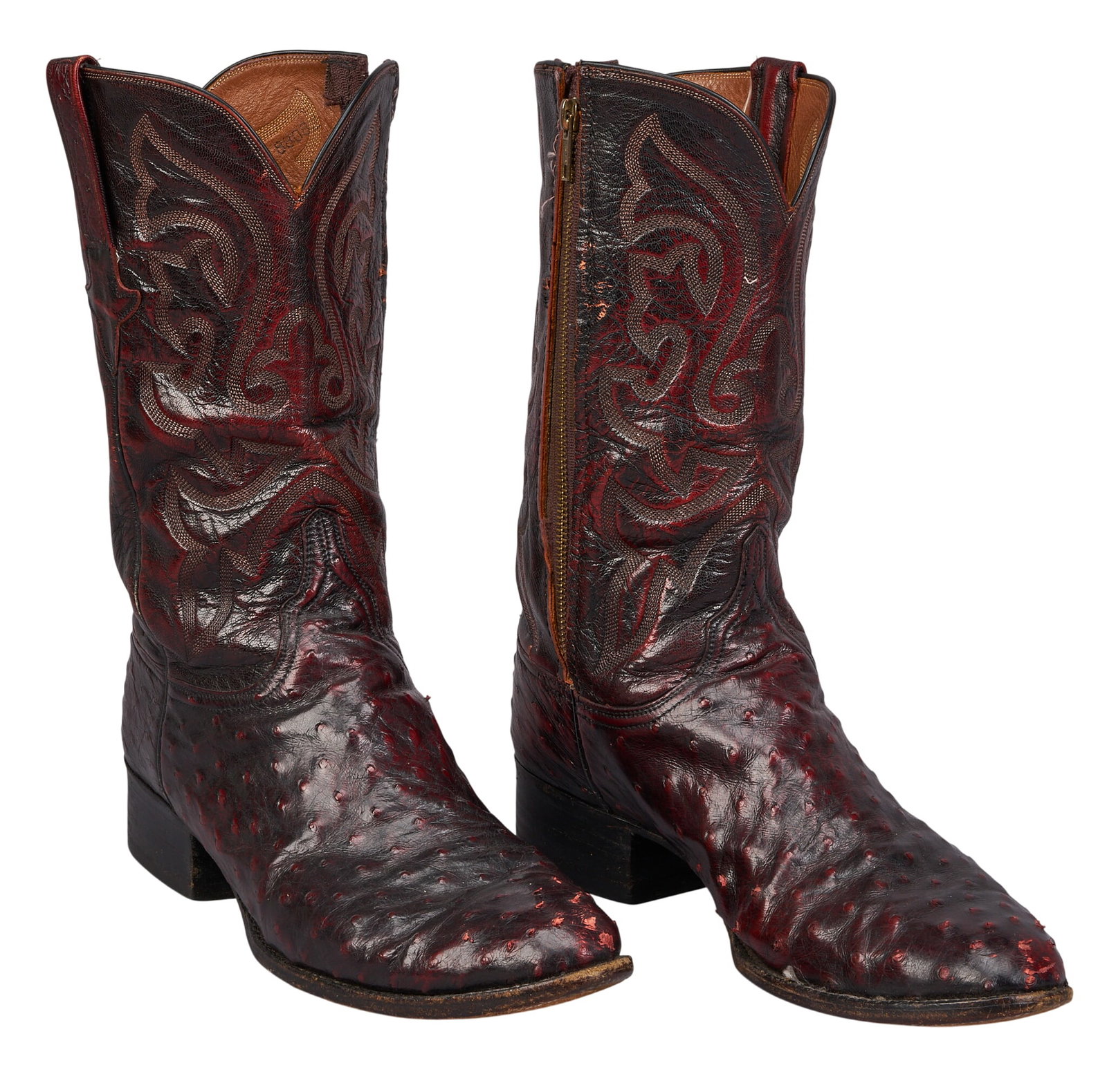 Red McCombs | Pair of Lucchese Oxblood Ostrich Leather Cowboy Boots, 12D: Pair of Lucchese (San Antonio, Texas) oxblood leather cowboy boots, with ostrich leather vamps, and zipper closure, size 12B, branded "Lucchese, San Antonio, Texas" inside height 13 in. x wi
