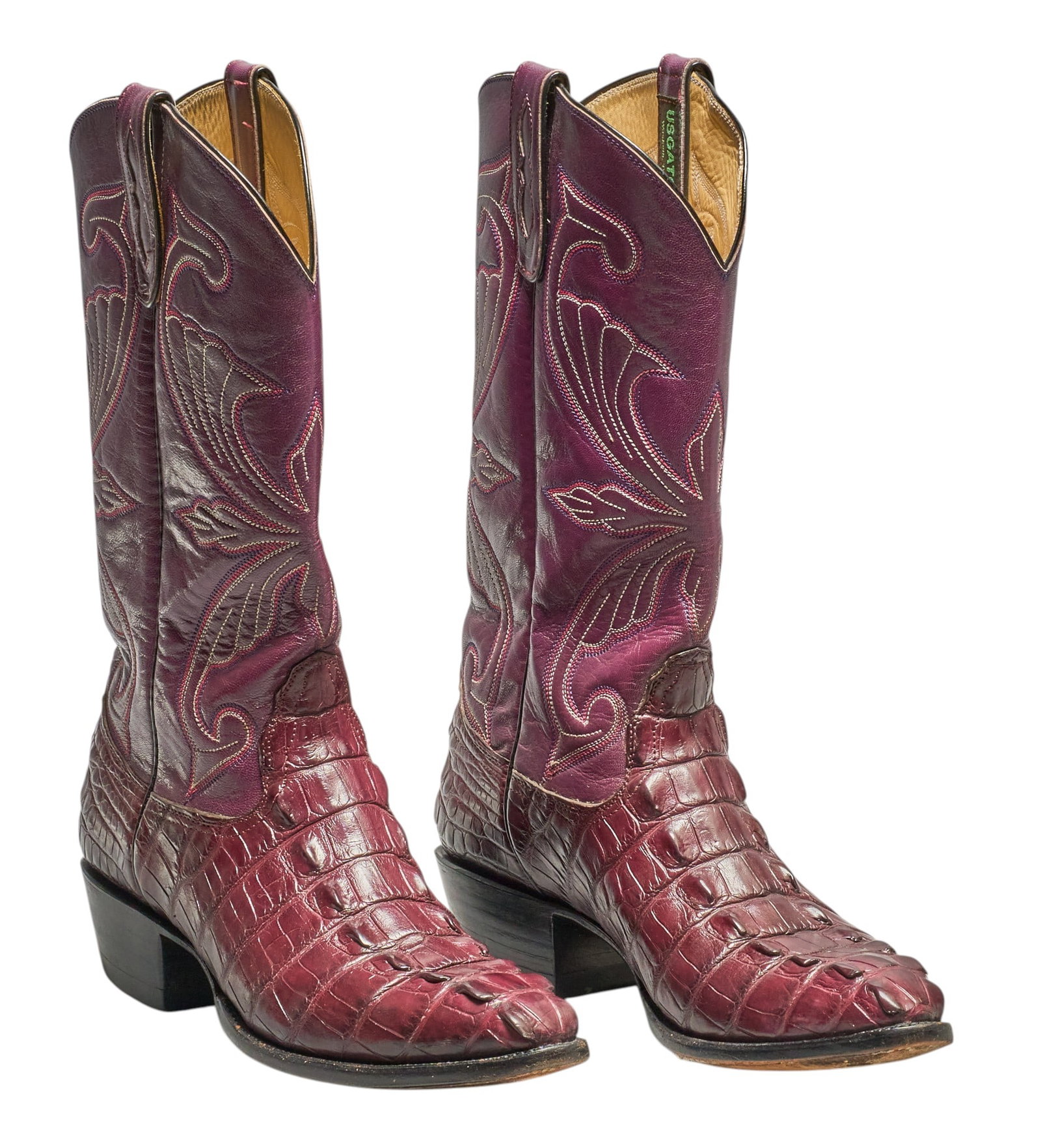 Red McCombs | Pair of USGATOR Alligator Boots, 12B:  Pair of USGATOR magenta leather boots with decorative stitching, and alligator vamps, size 12B height 15 in. x width 13 in. x depth 4 in. / each Condition A; excellent condition, shows little si