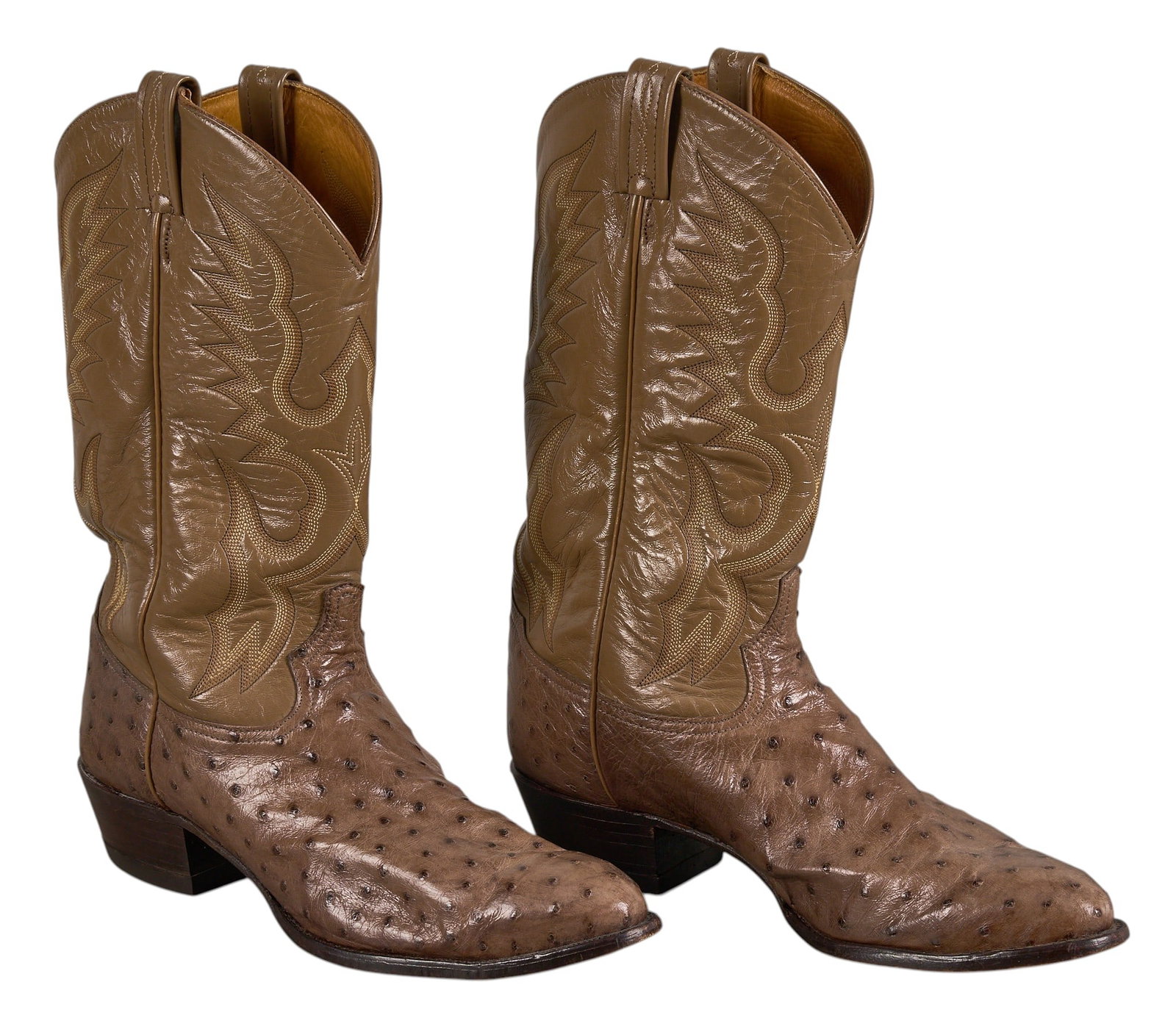 Red McCombs | Pair of Tony Lama Boots, 12D: Pair of Tony Lama brown leather cowboy boots with stitched decoration, and ostrich skin vamps, size 12D height 14.5 in. x width 4.25 in. x depth 12.25 in. / each