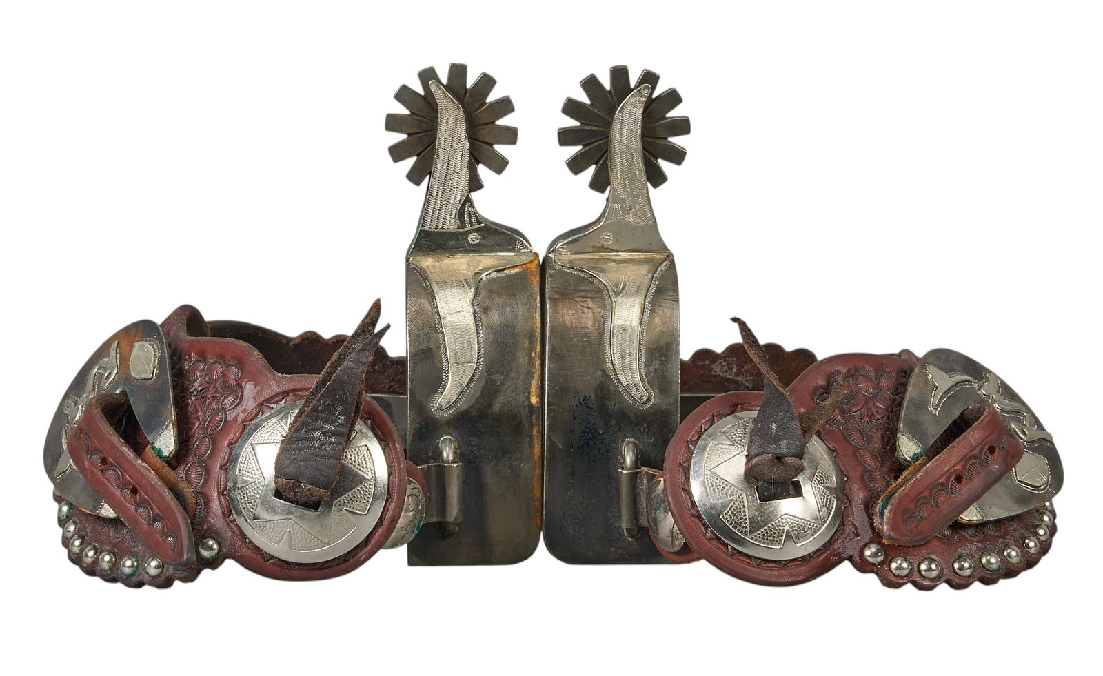 Red McCombs | Pair of Customized Western Spurs: Pair of customized Western spurs with featuring with McCombs Ranches brand, football, and longhorn motifs with silver overlay, engraved "To Red" on interior heel band, with to