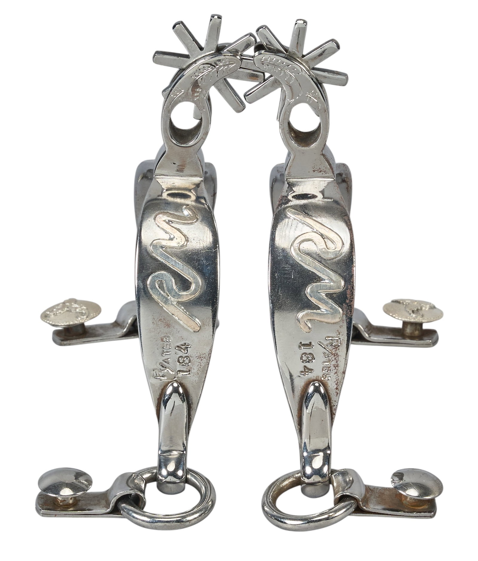 Red McCombs | Pair of Custom Russel Yates Silver Metal Spurs: Pair of custom Russel Yates (Rotan, Texas) silver metal spurs decorated with McCombs Ranches brand and silver overlaid floral motifs, engraved "Made For Red McCombs" on i