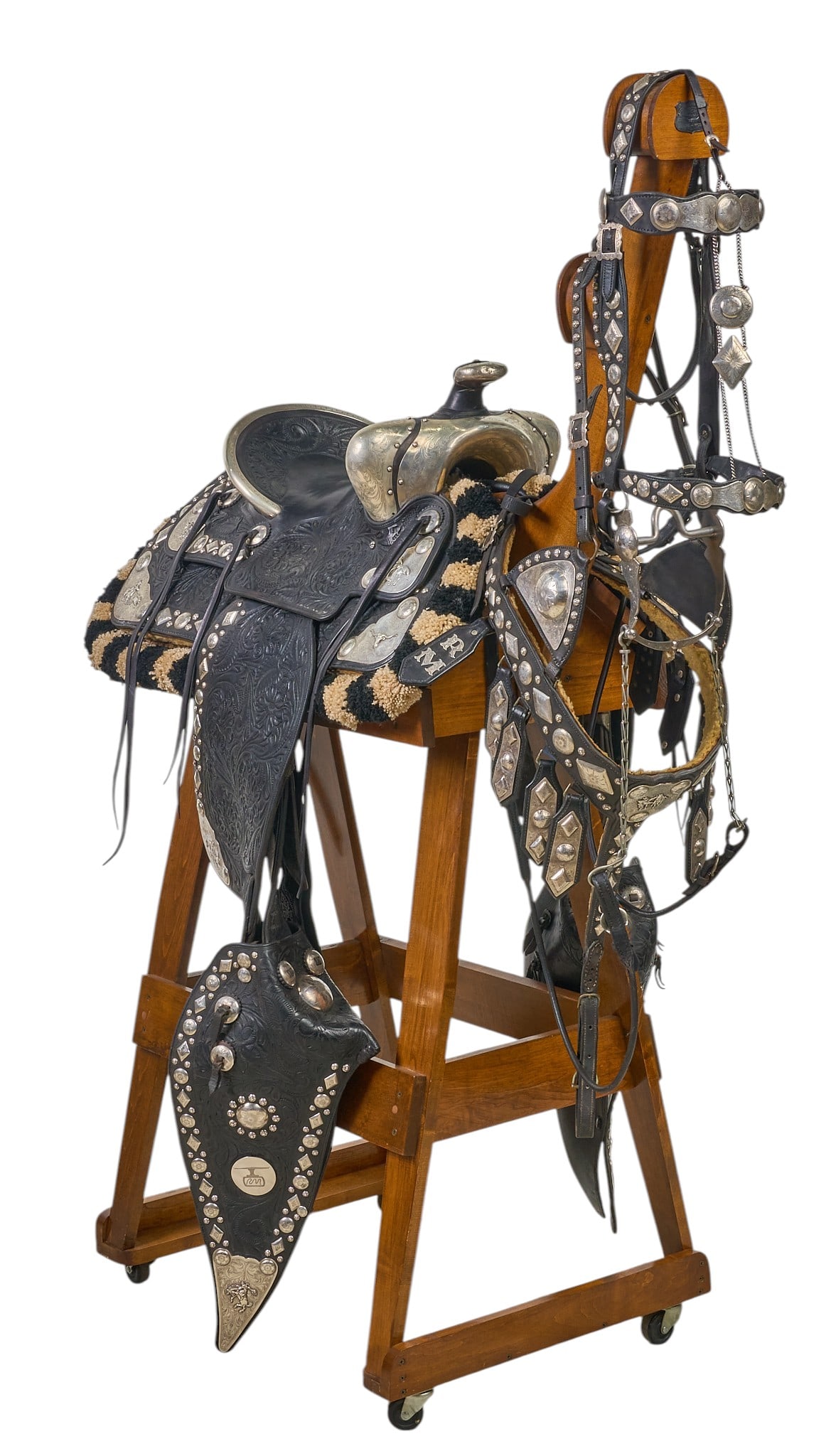 Red McCombs | Red McCombs' Personal Edward H. Bohlin "Lee Douglas" Saddle: Red McCombs' personal Edward H. Bohlin "Lee Douglas" model elaborately silver mounted, black, fully carved Parade Saddle with matching Breast Collar and Headstall, marked Edward H. Bohli