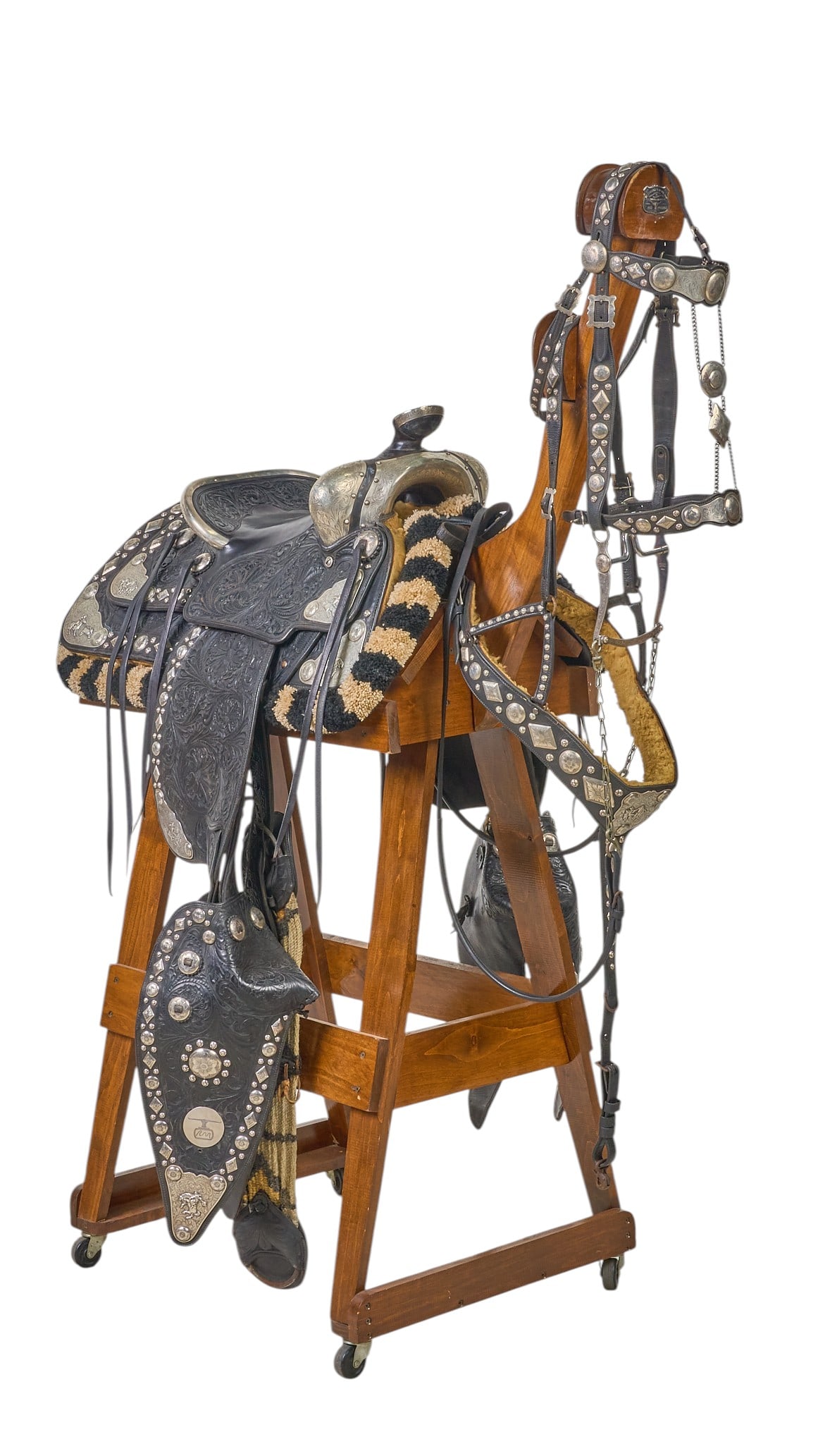 Red McCombs | Charlene McCombs' Personal Edward H. Bohlin "Lee Douglas" Saddle: Charlene McCombs' personal Edward H. Bohlin "Lee Douglas" model elaborately silver mounted, black, fully carved Parade Saddle with matching Breast Collar and Headstall, marked Edward H. 